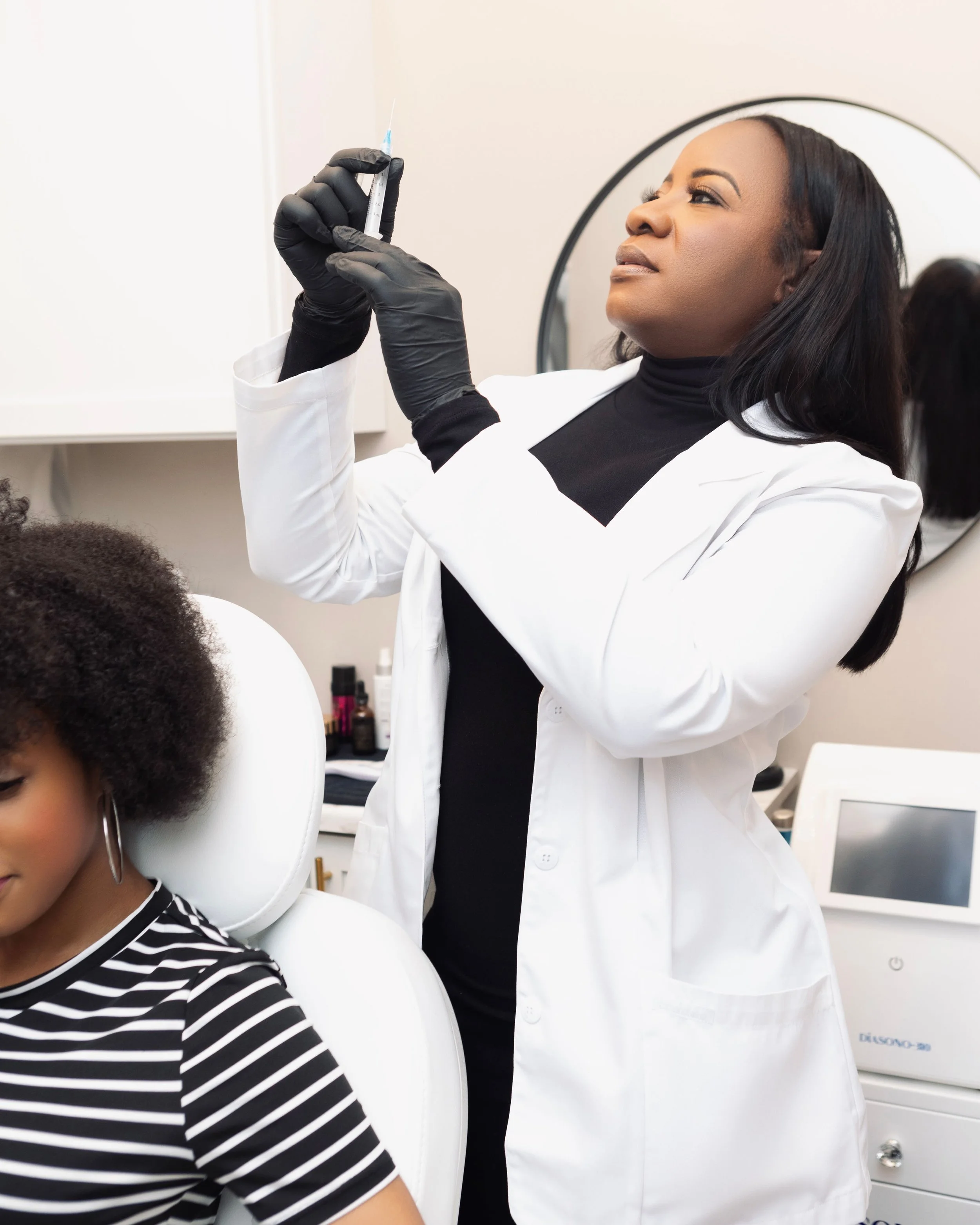 A trichology professional preparing a personalized scalp wellness treatment for a client.