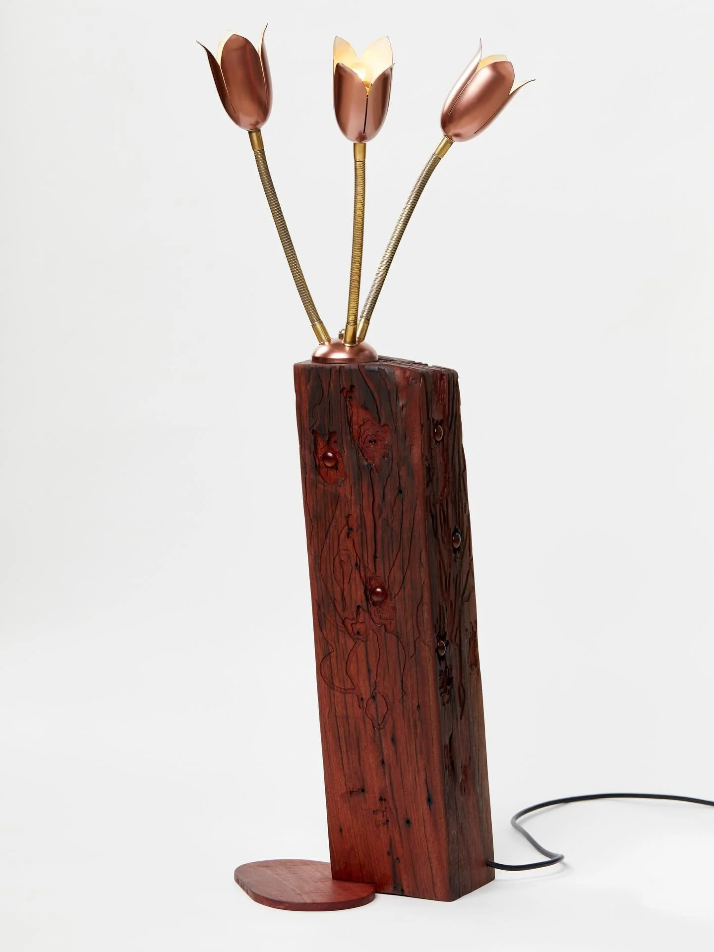 &ldquo;Rebloom&rdquo;
A recycled Redgum post, once discovered in the roof of an artist&rsquo;s studio in Thornbury, has been reimagined as a functional lamp. 

Celebrating its original character with the angle of the timber, the same nail holes, and 