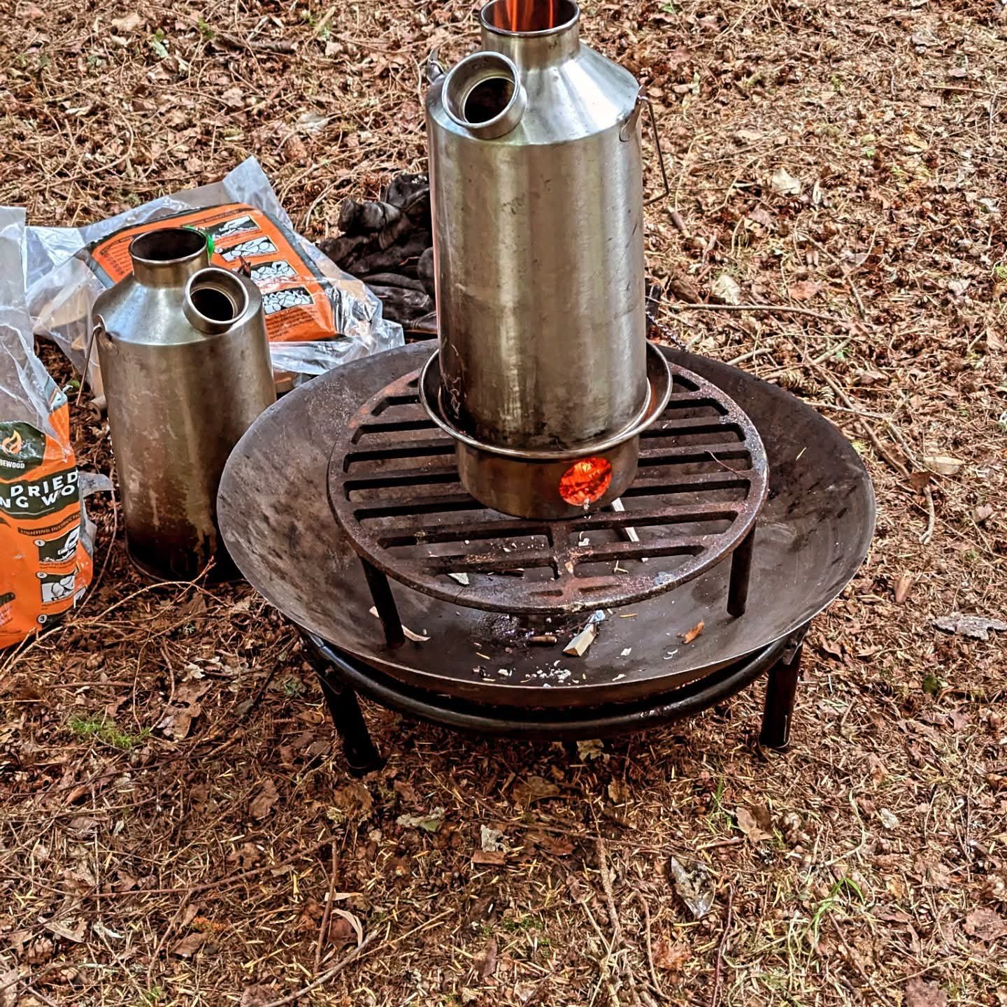 campfire with a metal cylinder on top 