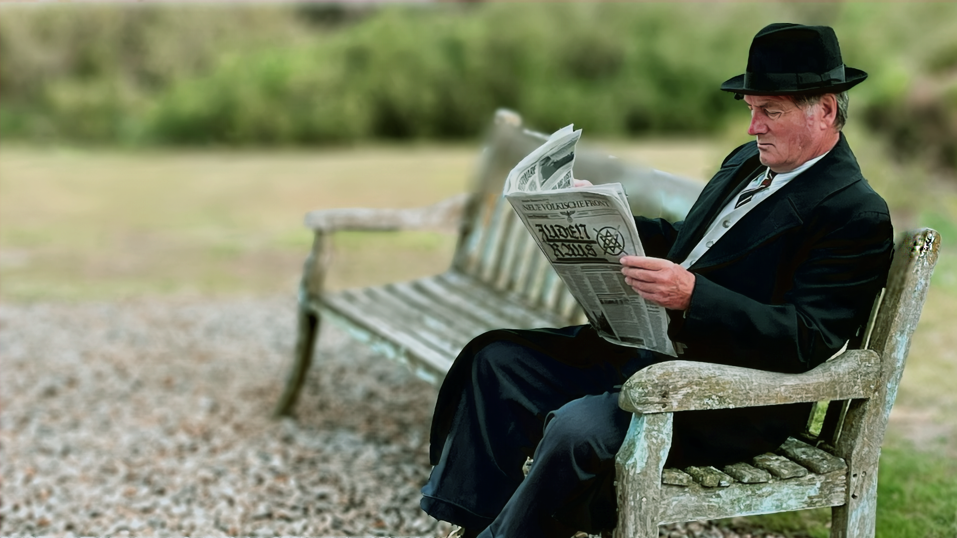 actor with newspaper.png
