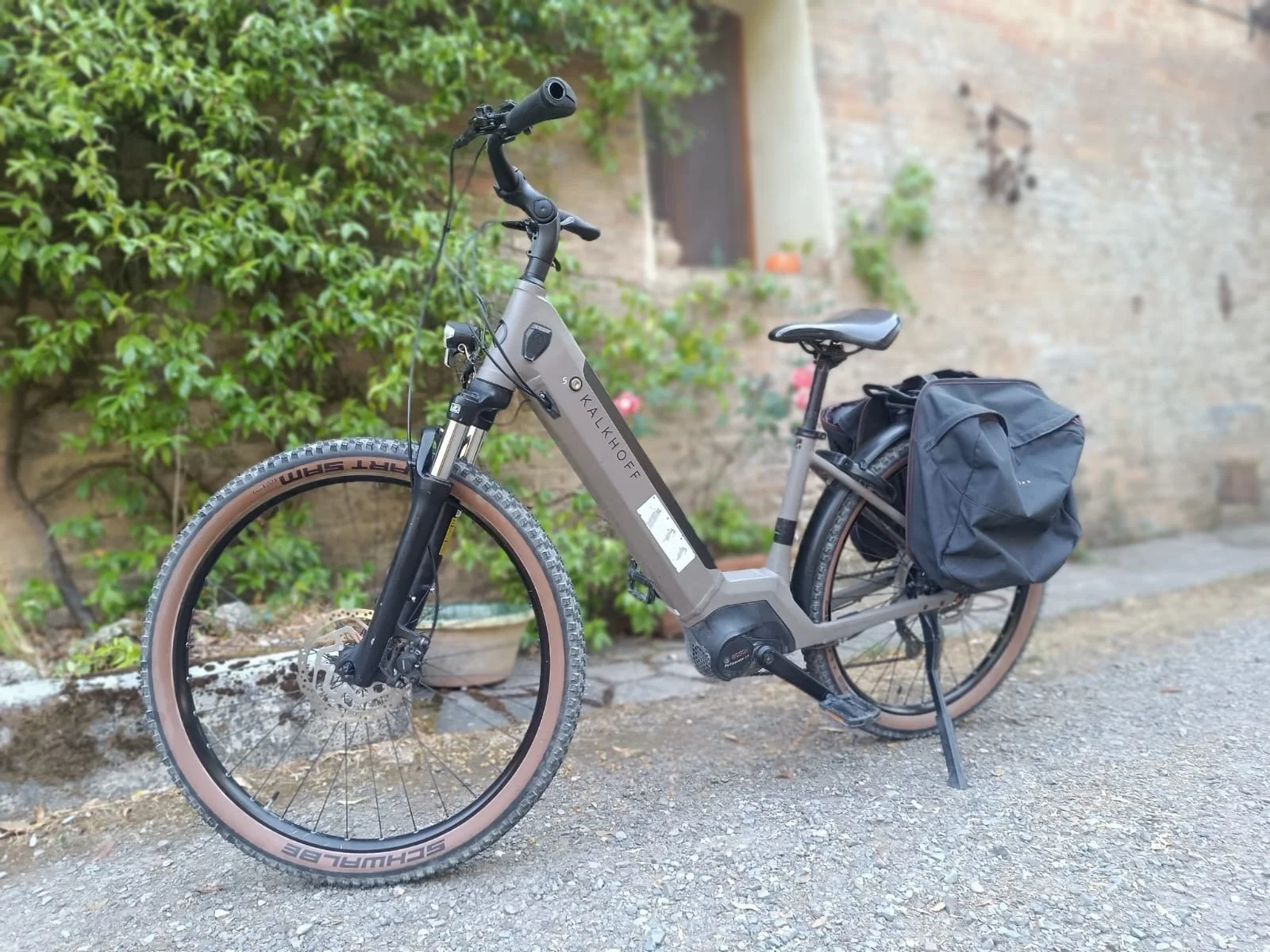 Pedal-Assist E bike, step through frame, brand Kalkhoff with a gray frame and black components