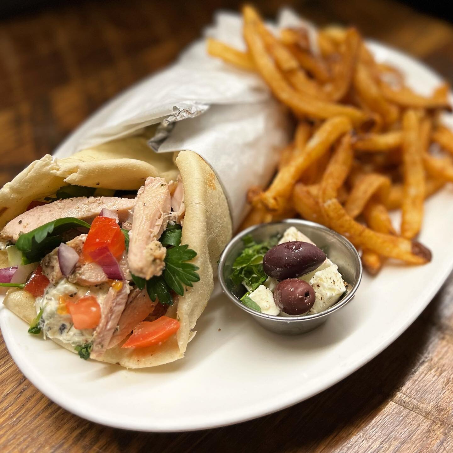 Grilled Chicken Gyro 🥙 yogurt, lemon &amp; herb marinated all-natural chicken thigh, house tzatziki, chopped salad, our fresh grilled pita, hand-cut fries, olives and feta 🇬🇷 #gyro #chickengyro #chickengyros #greekfood #greekcooking #frenchfries #