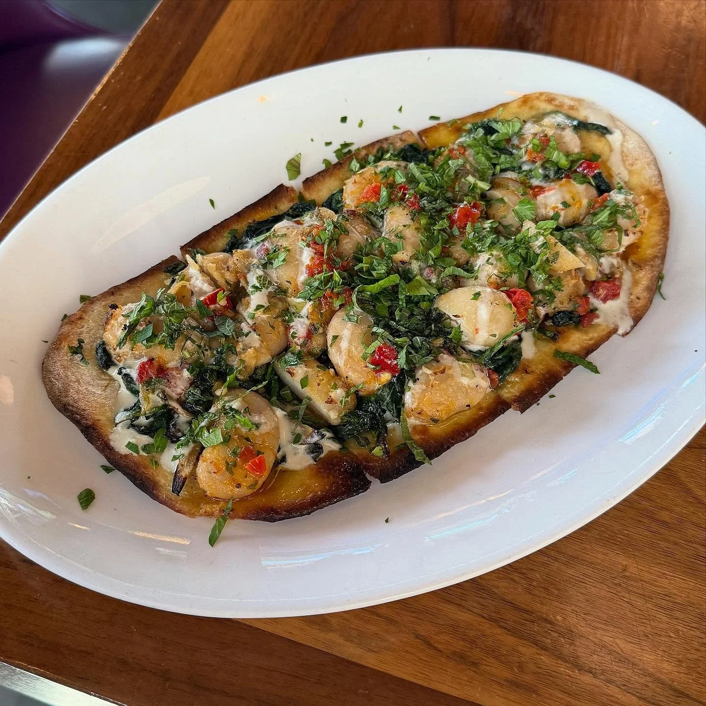 β¨πΏ NEW SPECIAL π« π£ introducing our “Beans + Greens Flatbread” with creamy marinated white gigante beans from #Greece, garlicky sautéed spinach, roasted shallots, lemon-tahini drizzle, #Calabrian chili oil! Naturally vegan and ve
