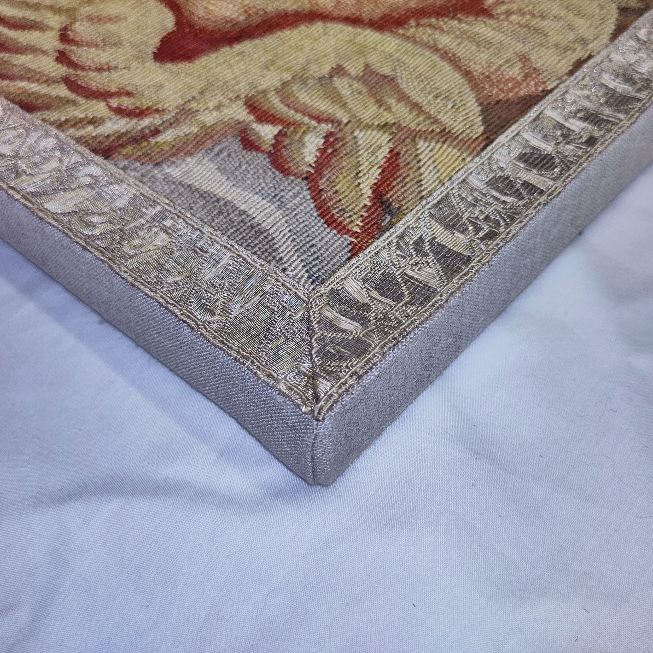 Tapestry 17th century border fragment cherub 2.jpg