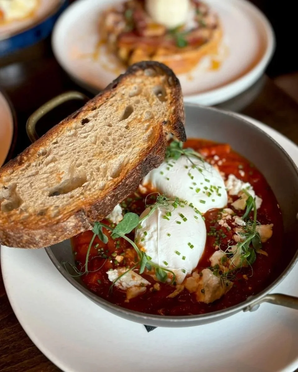 Shakshuka eggs 2 eggs poached in a lightly spiced tomato ragu, served with Hugo’s sourdough toast