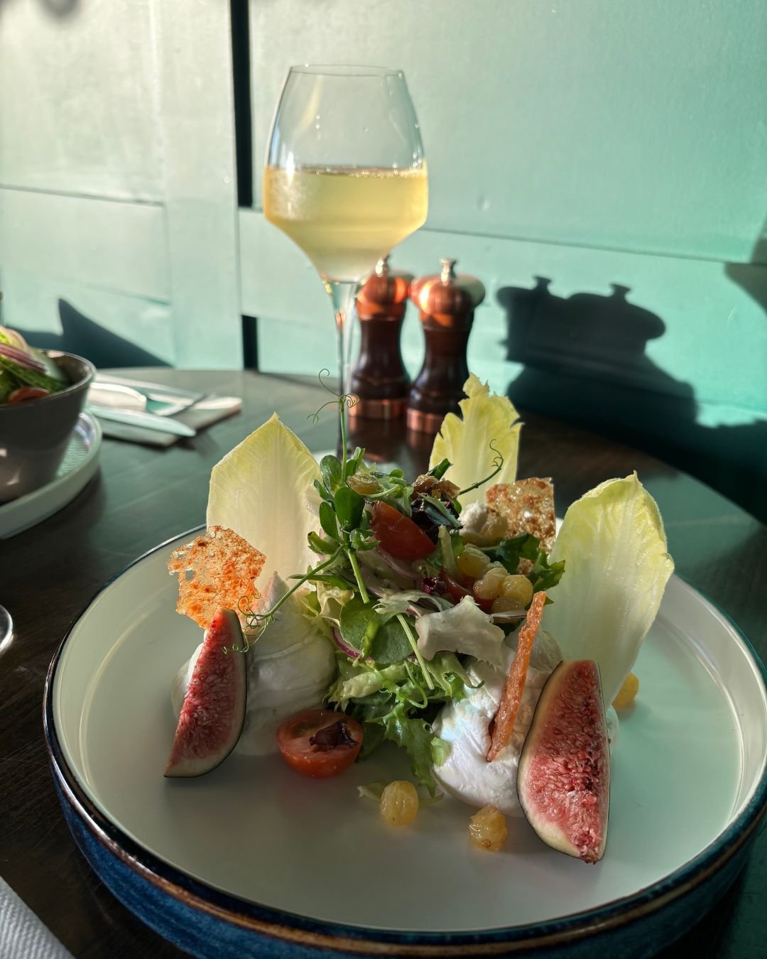 Whipped goats cheese salad Fresh fig, dressed chicory, watercress, hazelnut brittle and golden raisin dressing