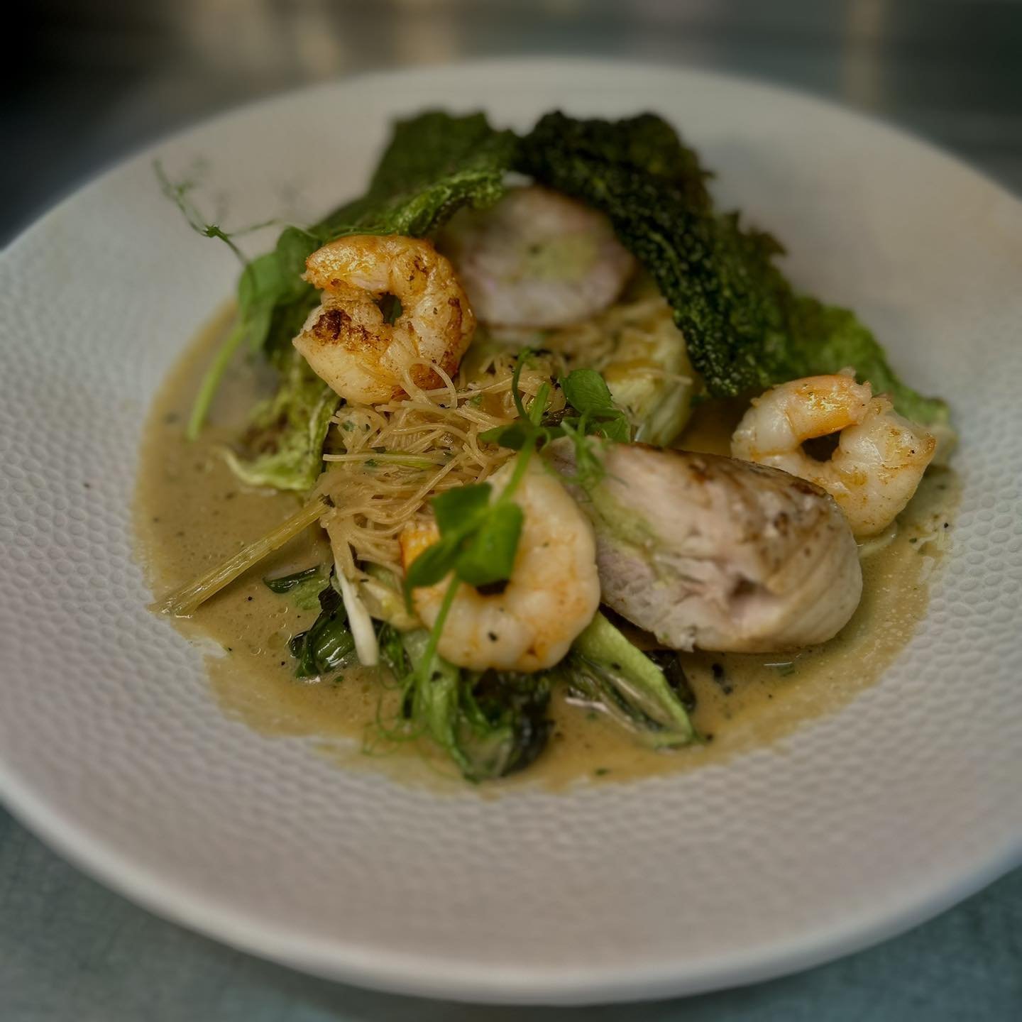 Another mouthwatering special from this week - Wivenhoe landed Hake with a Thai prawn mousse, rice noodles and broth 

#anchorinn #anchorinnpub #anchornayland #Nayland #Naylandsuffolk #suffolkcountyinns #suffolk #suffolkpub #suffolkcountryside #essex