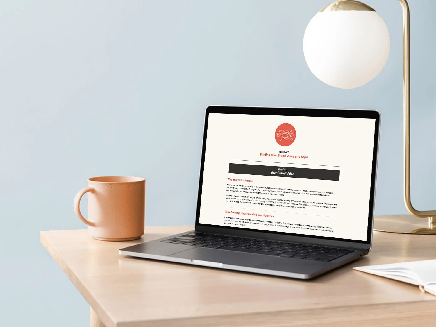 Google doc template on laptop sitting on desk with mug and lamp