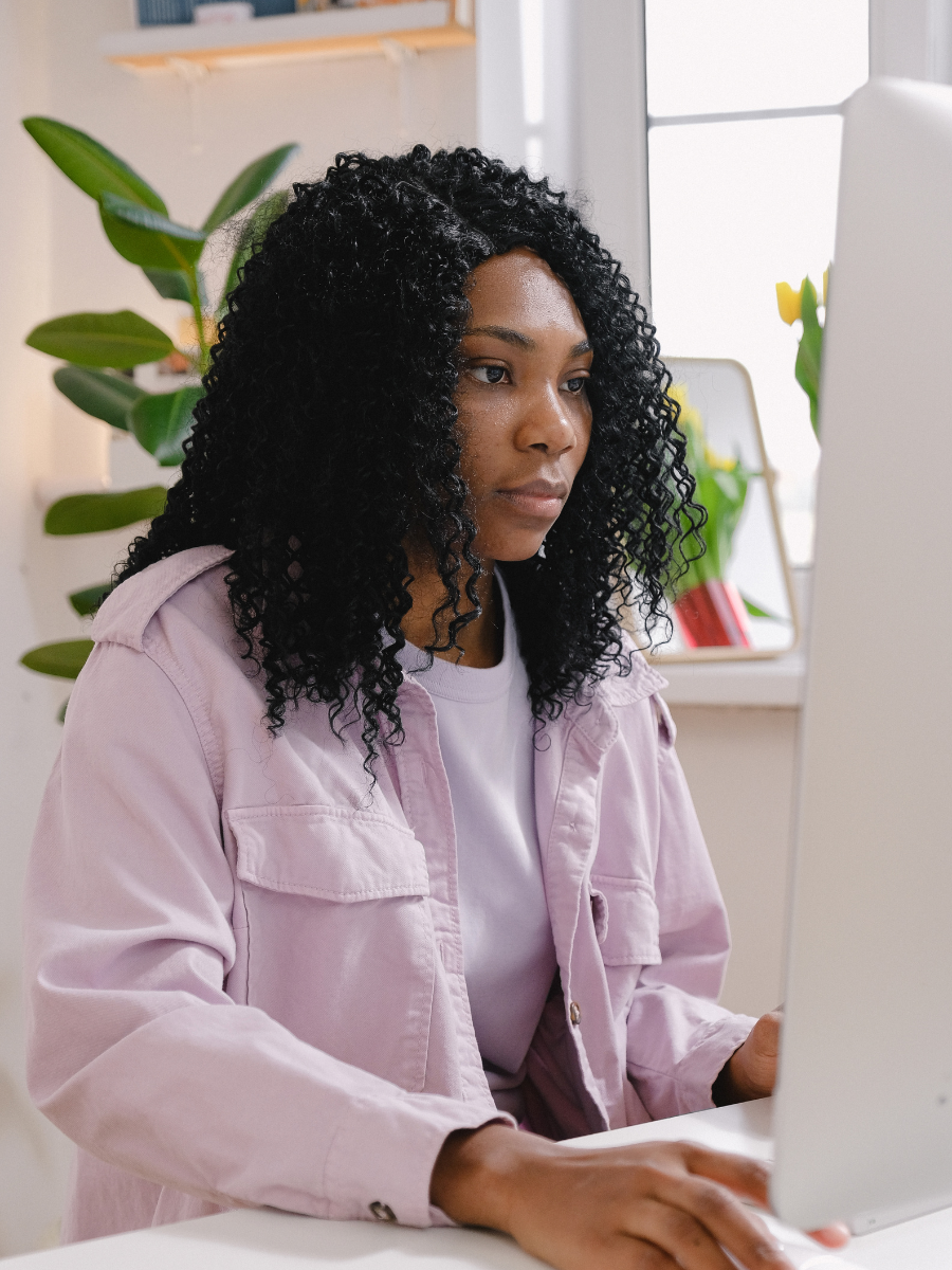 BIPOC woman on computer