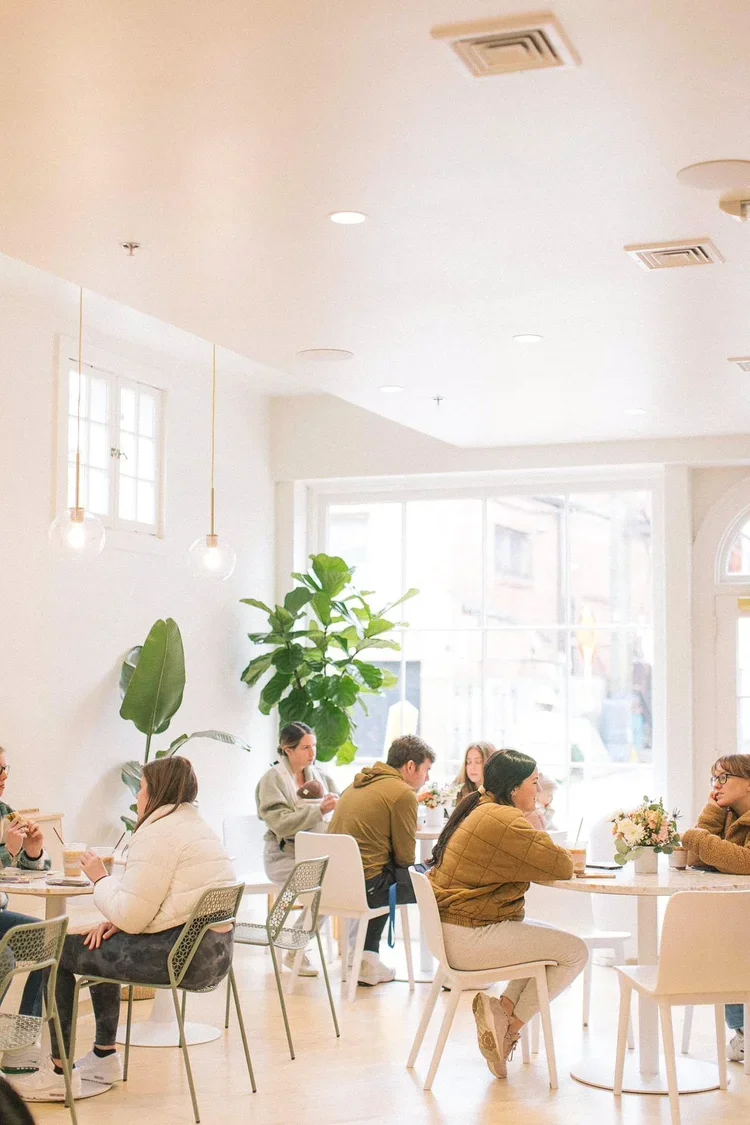 Cozy cafe interior with fresh flower arrangements