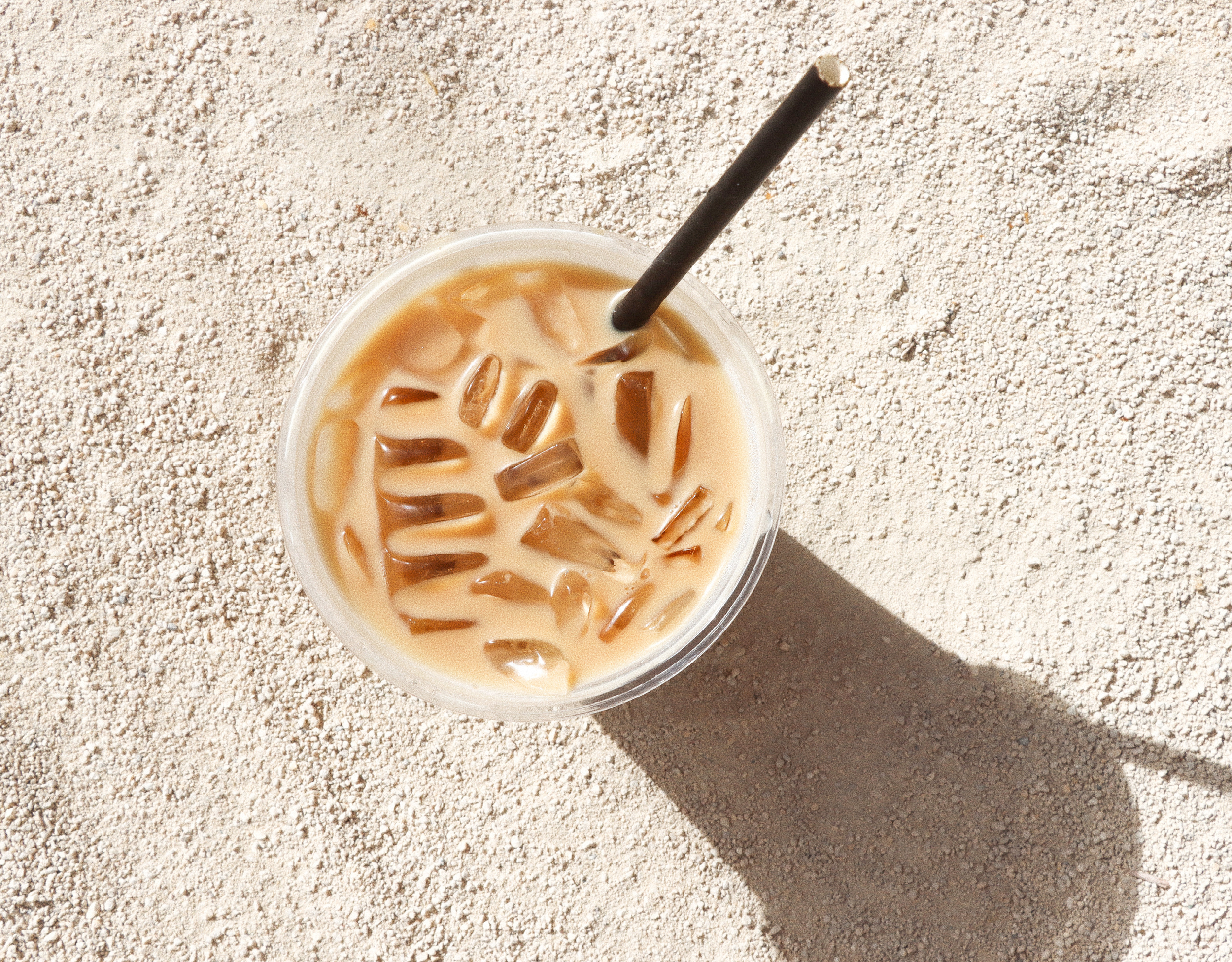 Iced latte with milk and black straw