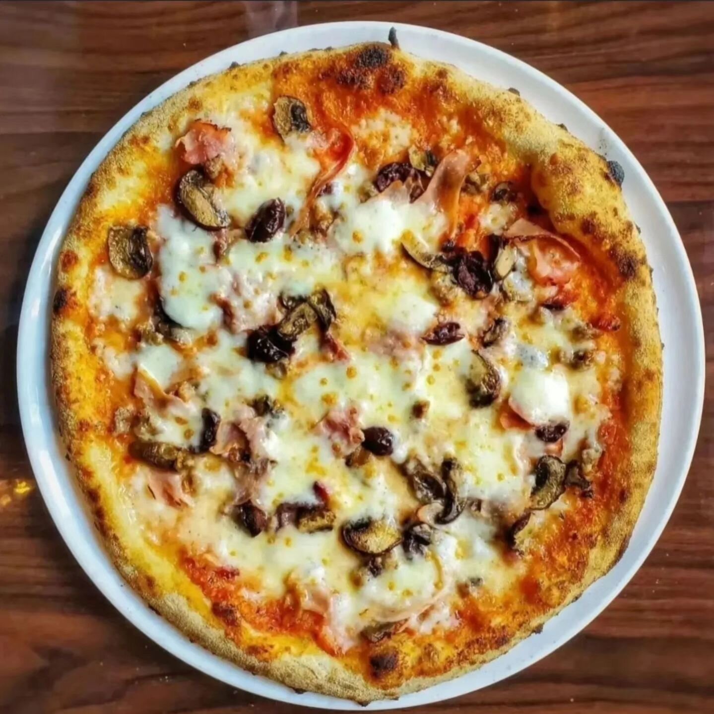 Lunch is served every Tuesday through Saturday. Here we have our Suprema made with house-made sausage, nueske's bacon, ham, olives, mushrooms, and parmesan served on our dough made from imported Italian flour.

#pizzaplease #pizzatime #pizzapizza #pi