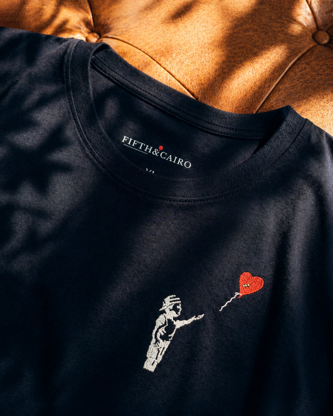 Close-up of the embroidered ©LVSE Boy design on the FIFTH&CAIRO T-shirt