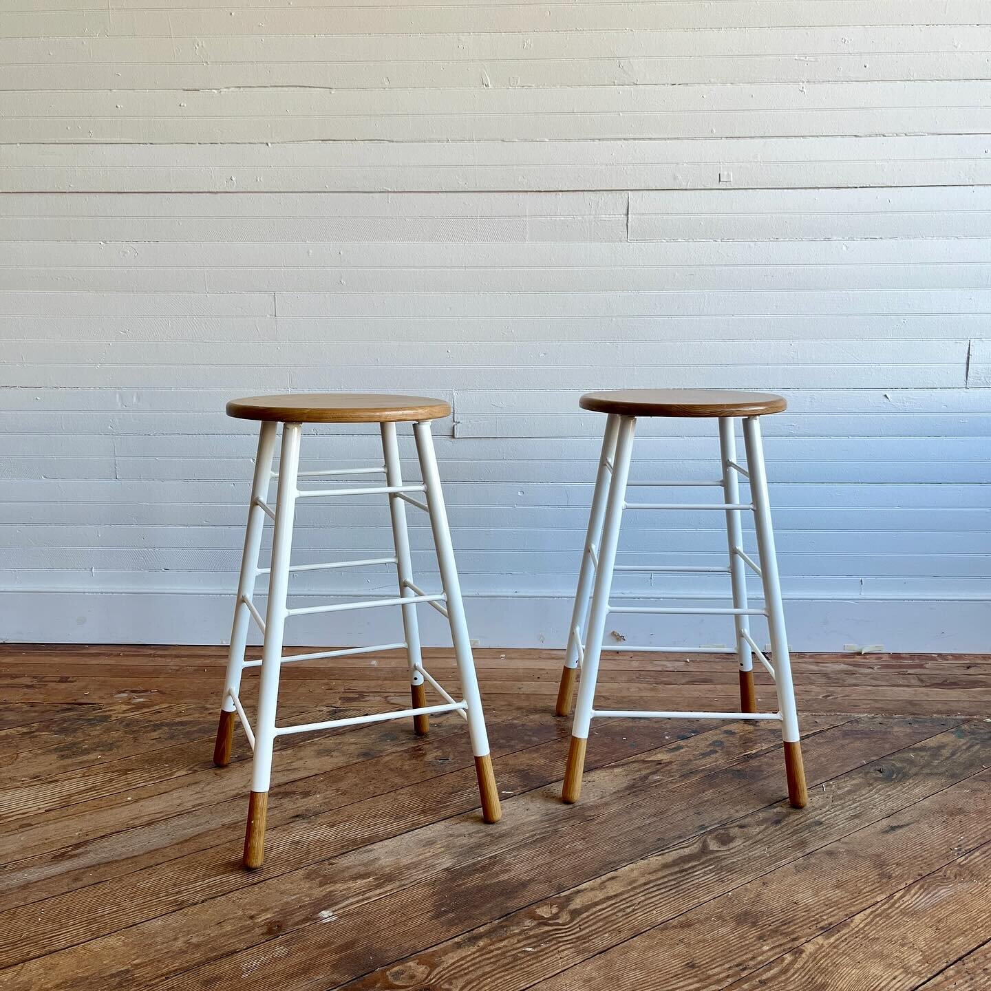 Pair of Lostine Gordon Counter Height stools.  Heavy iron base with with oak seat / feet.  Some minor scuffing to frame, seat has a scuff on side shown in photos.

28&rdquo; tall x 16&rdquo; w at base

$345 for the pair (retail for $585 each)