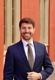 Image of Graham Williams in front of a building