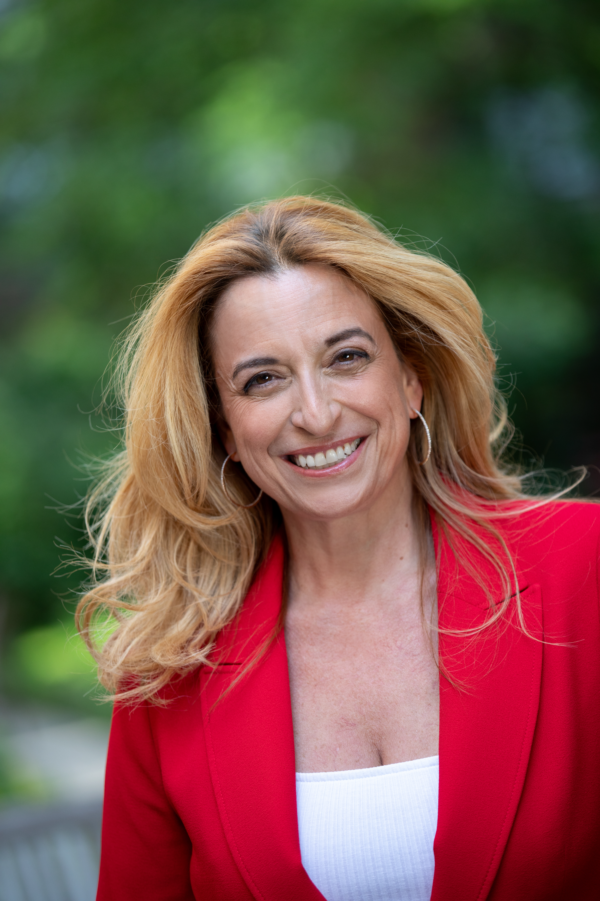 Nathalie Botros wearing a red suit