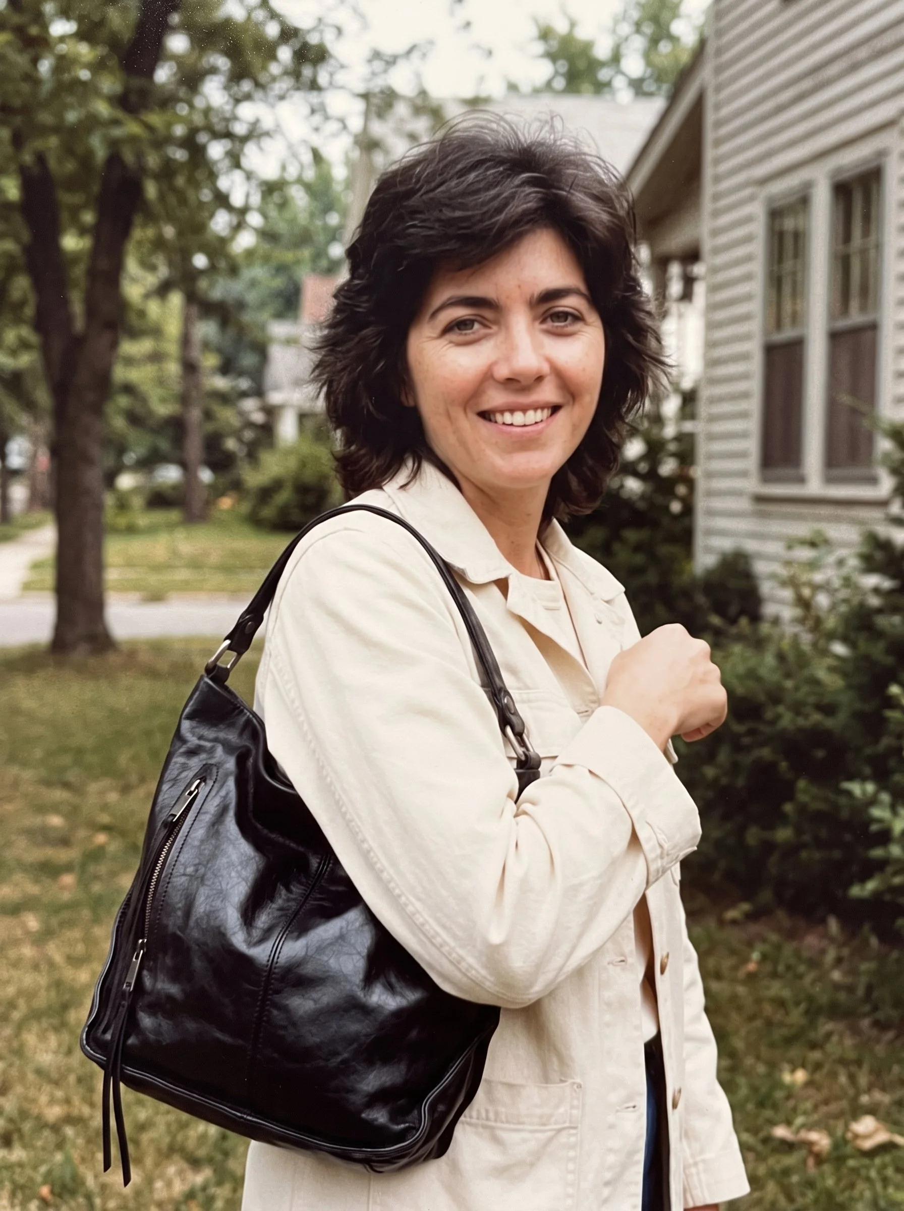 Karen Farnsworth wearing HOBO Shoulder Bag in black and vintage Guess denim jacket in off white.  Photo by David Braselton