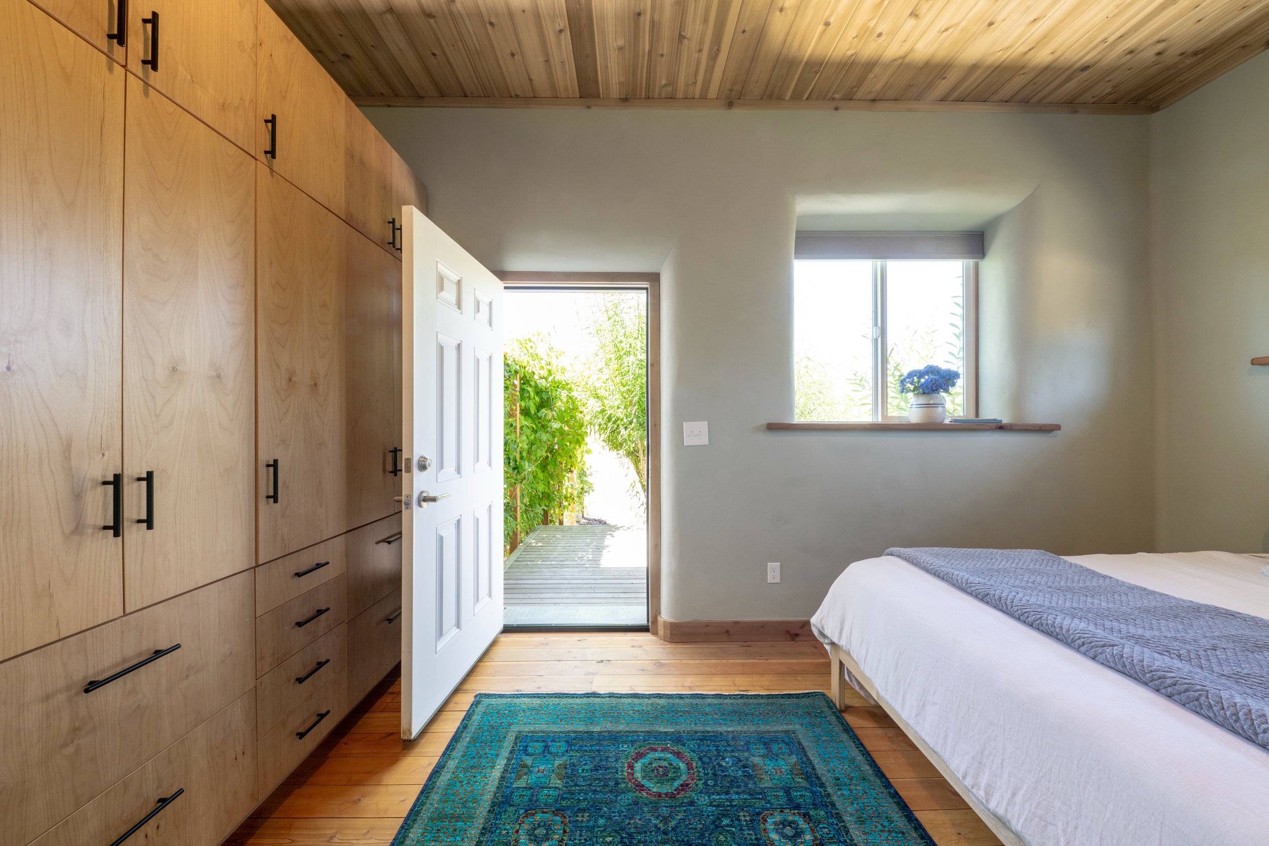 be-easy-farm-primary-bedroom-custom-storage-garden-access-sequim-wa.jpg