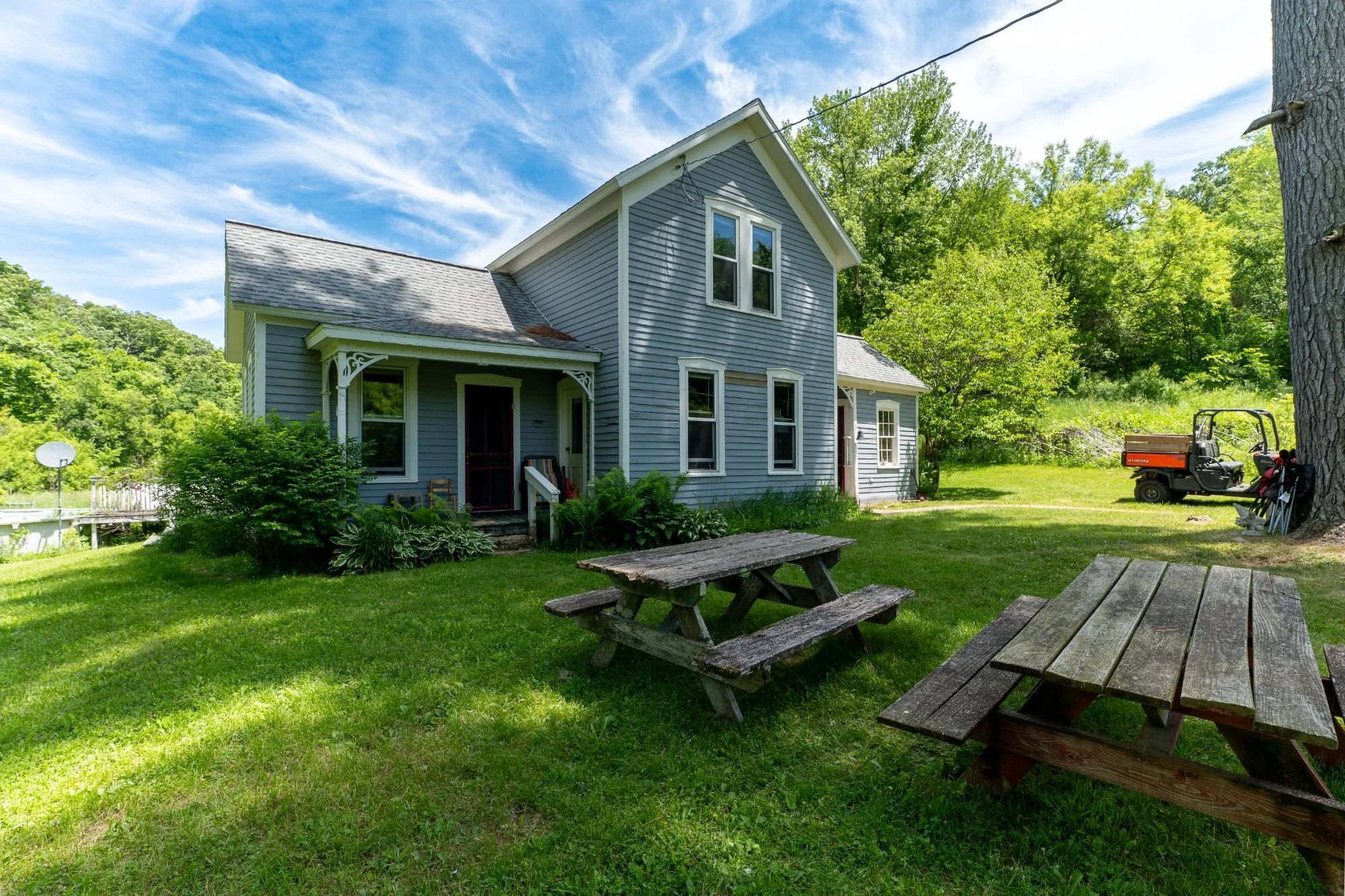 Back porch of well-preserved farmhouse on Three Sisters Farm