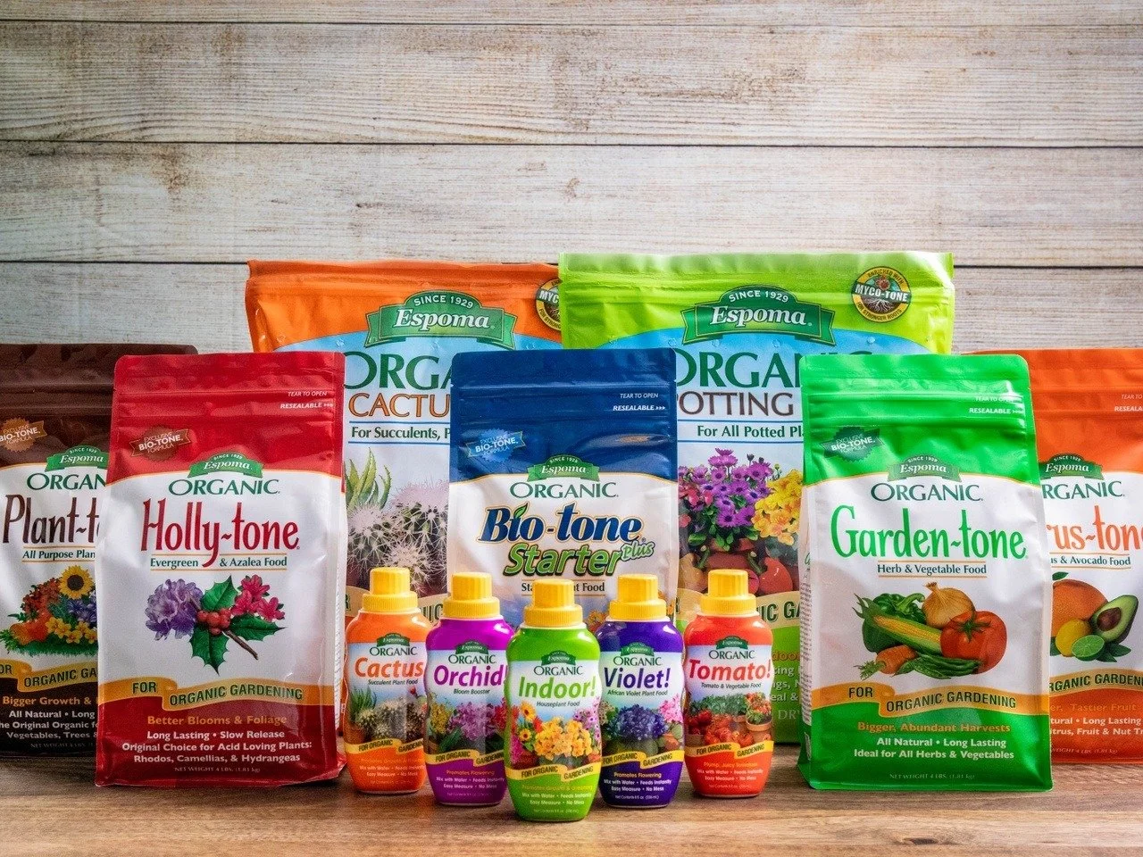 A collection of Espoma organic gardening products for various types of plants.