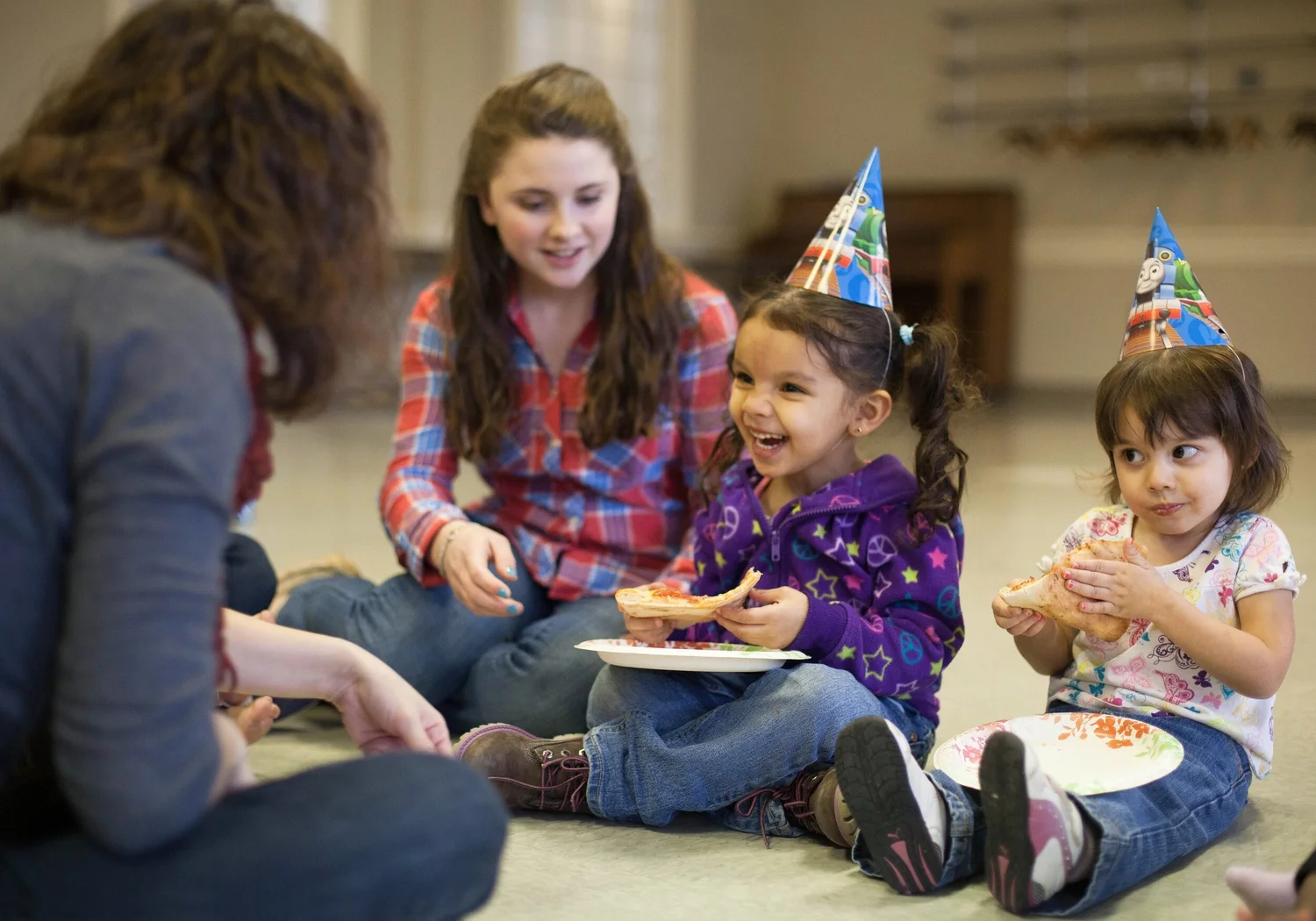 Children sharing a meal and enjoying a celebration together