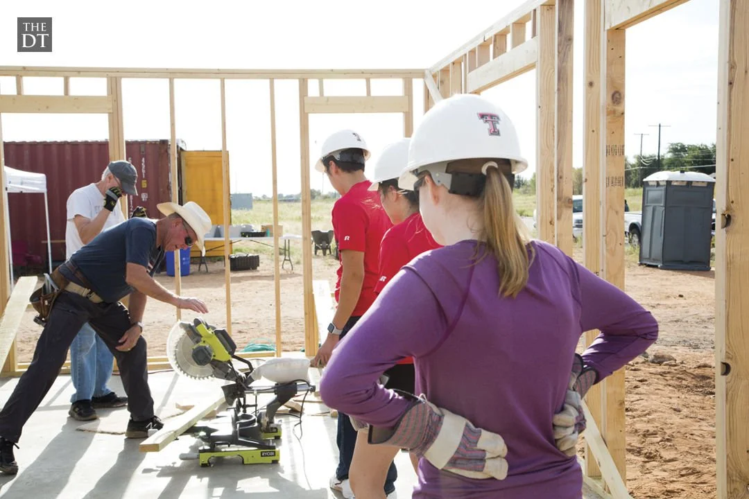 Volunteers working together on a Habitat for Humanity home