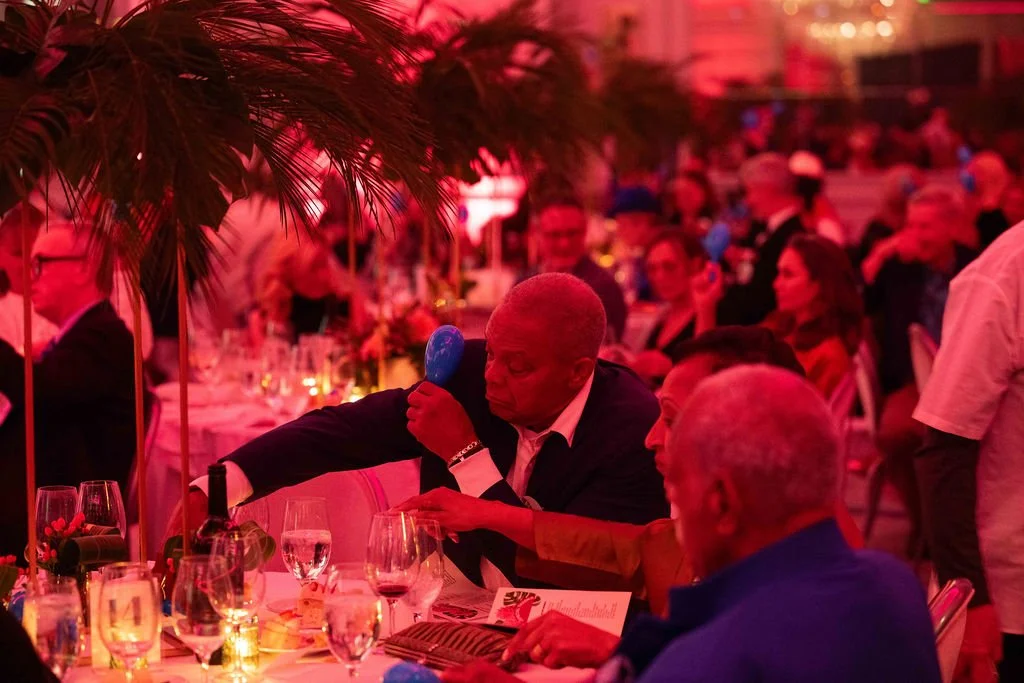 packed nonprofit gala during live auction bidding