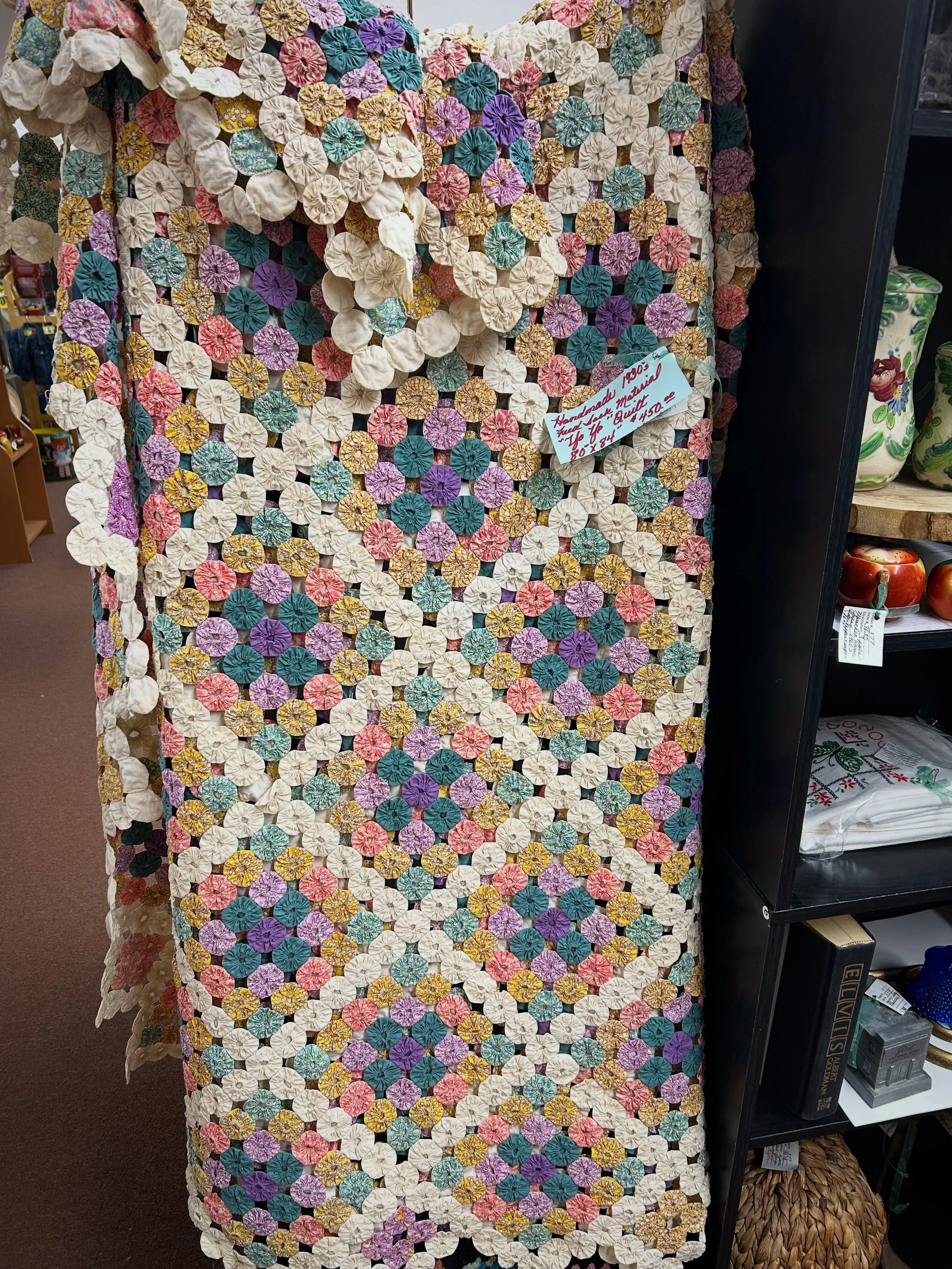 We have no idea how many hours someone put their love, sweat and tears into this stunning yoyo quilt, but it is PERFECTION! 🙌 Come check it out from 10-5 today! 🩷🩷🩷