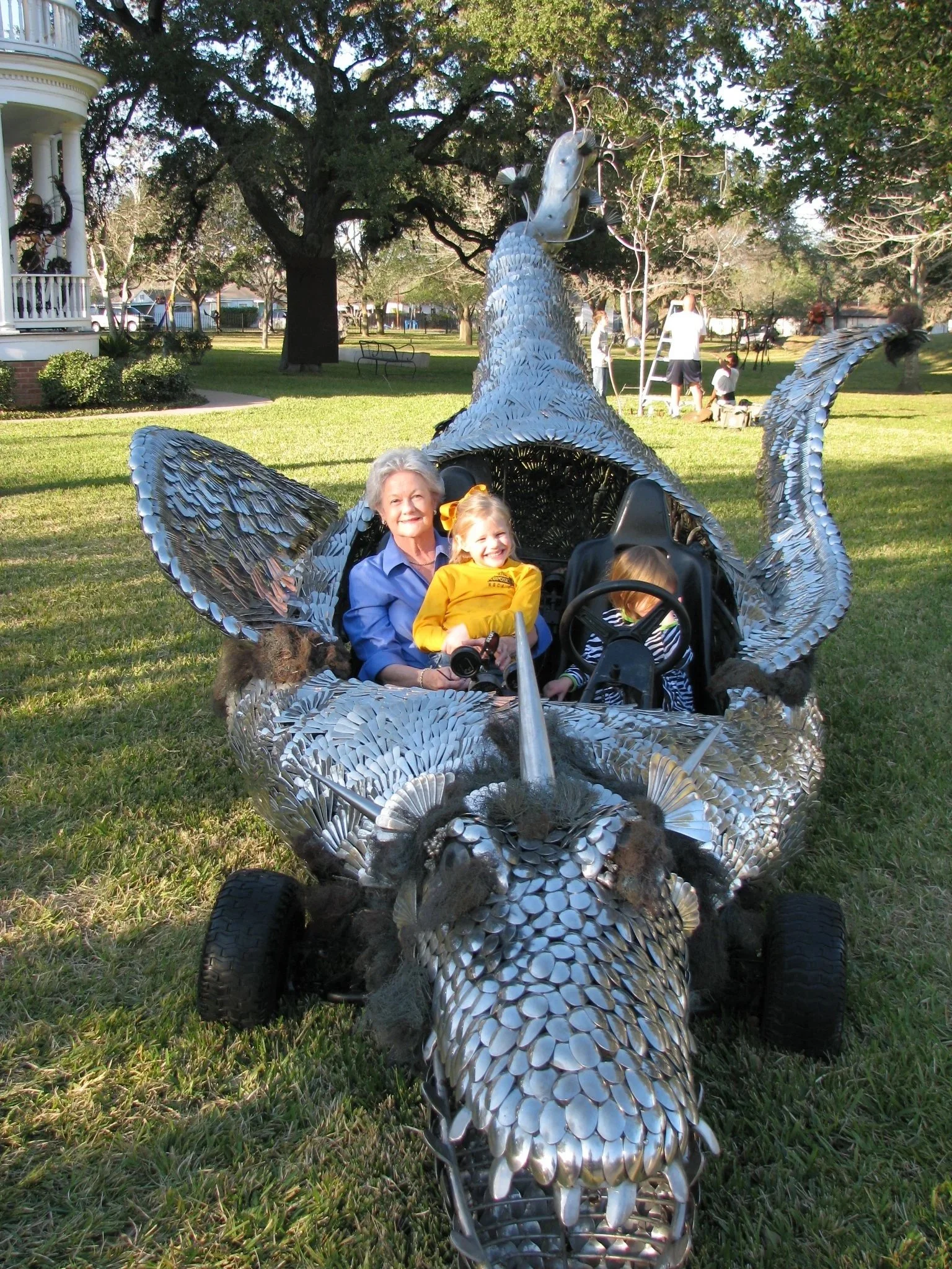 Top Ambassador-Docent with her grandchildren in a Scrapdaddy Art Car!