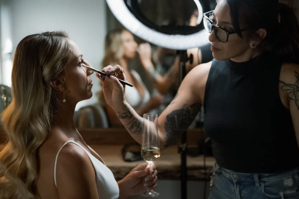Andrea Betancourt applying bridal makeup.