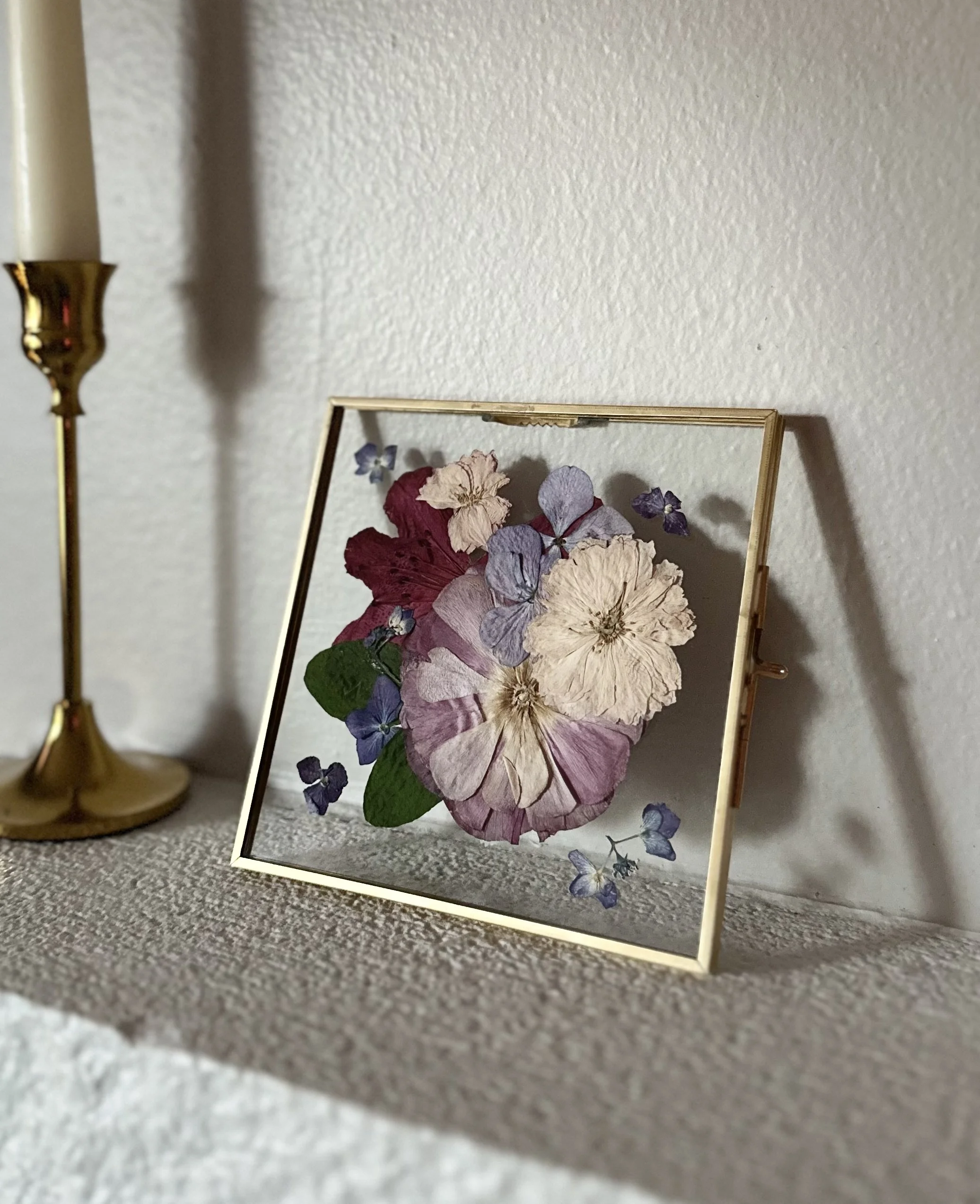 Pressed FLower Art framed in gold metal floating frame with purple, light pink and dark pink flowers
