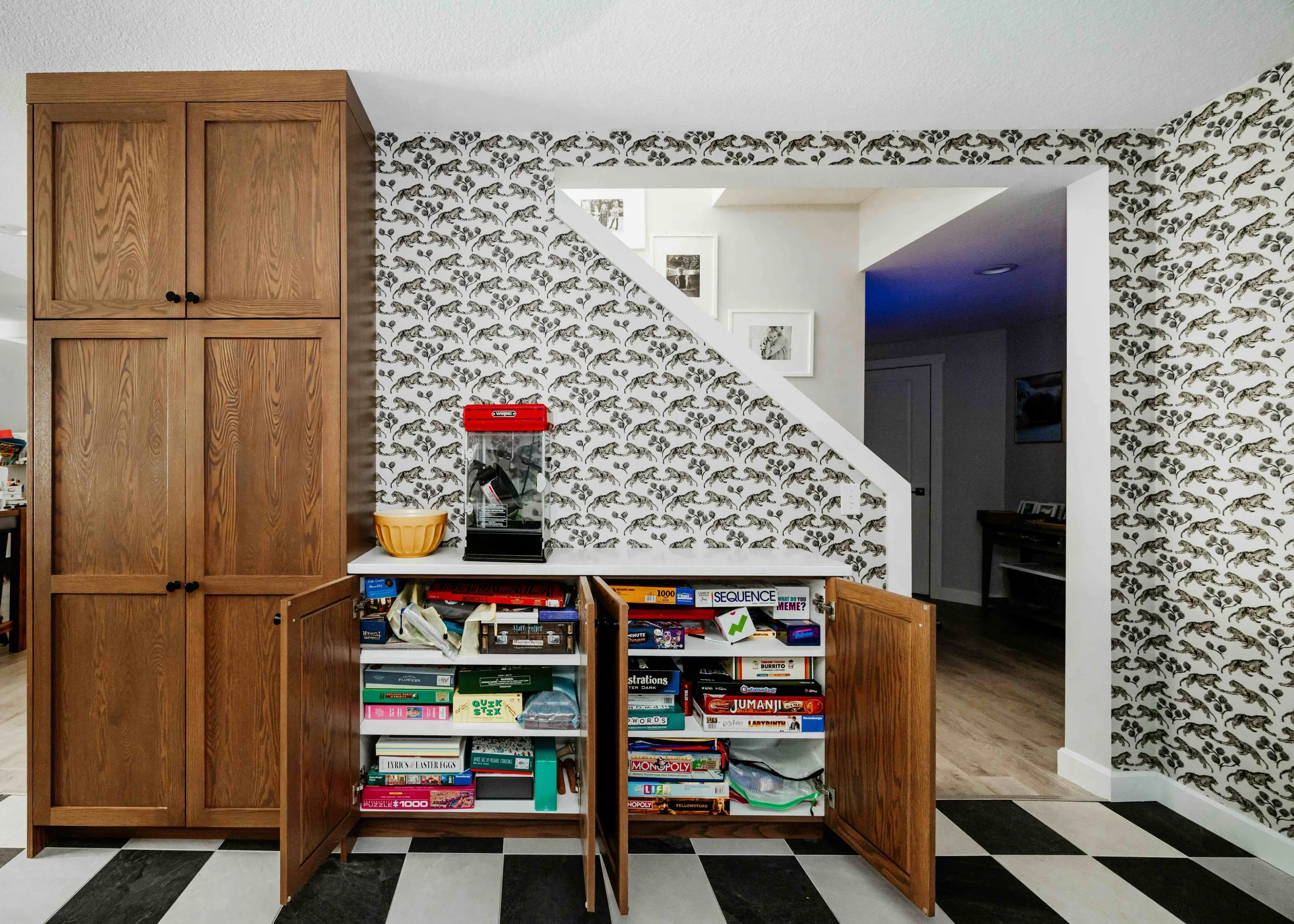custom red oak cabinetry in a custom basement and tiger grasscloth wallpaper by Sarah Sherman Samuel