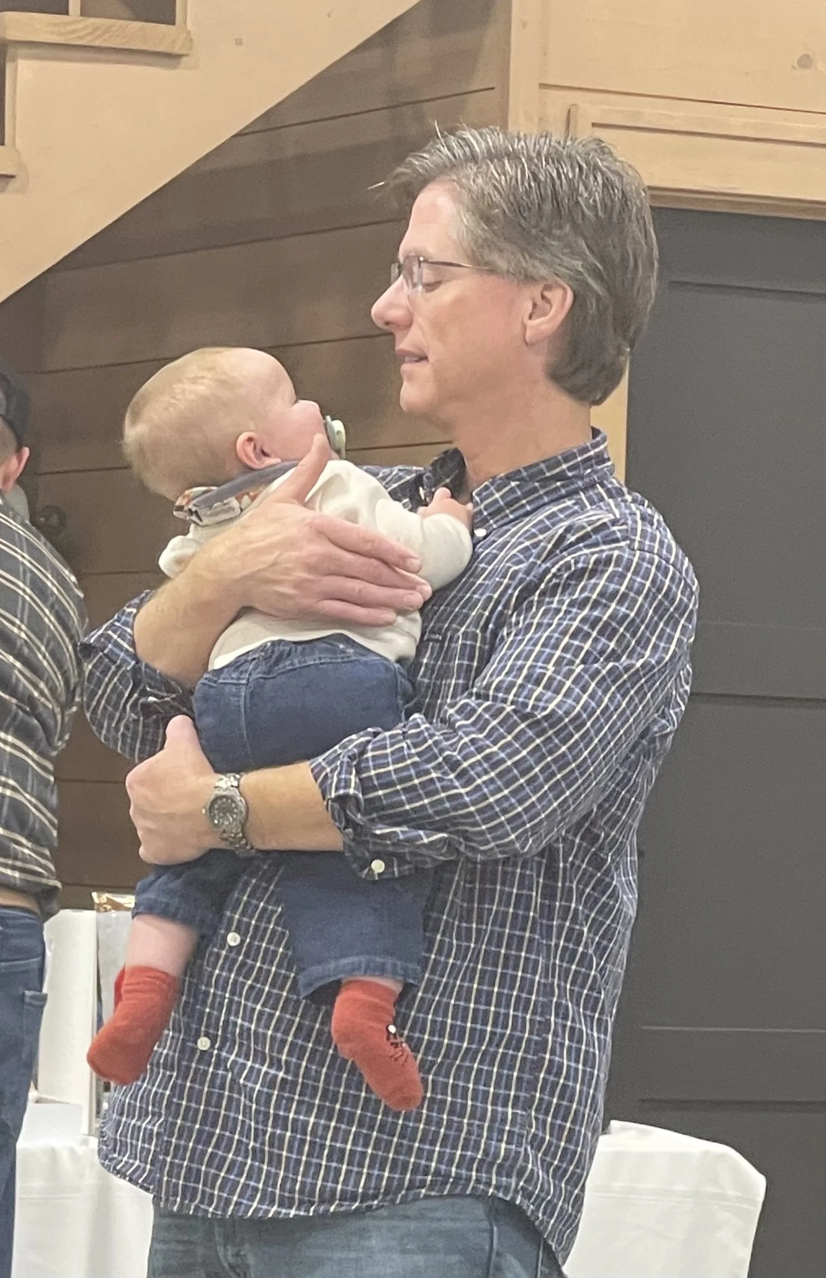 Zach Pryor, our designer at Sean’s Cabinetry is holding his baby