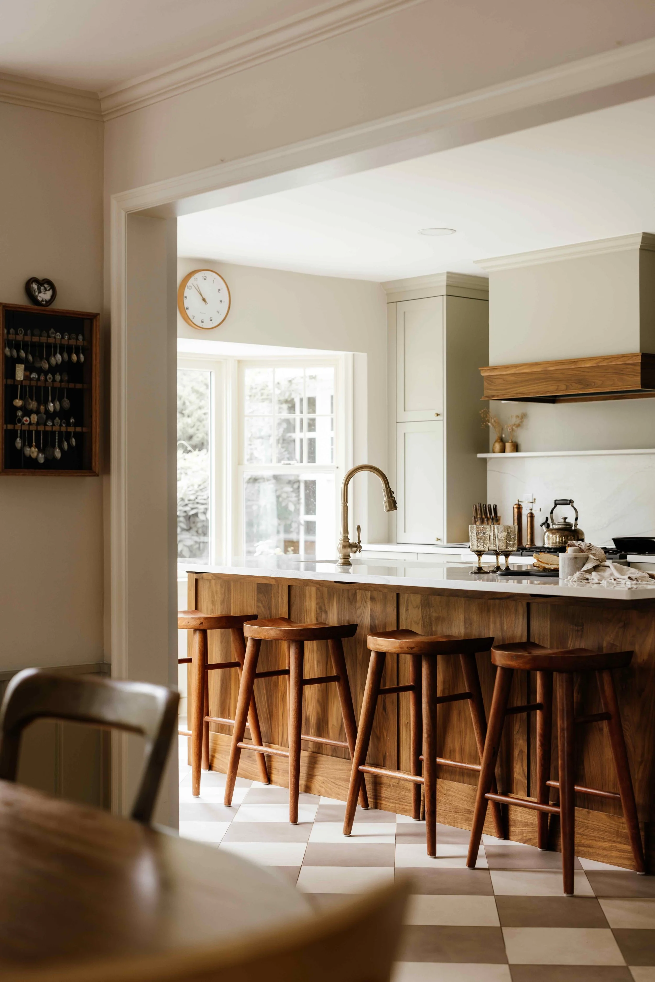 Frameless Cabinetry in Farrow  and Ball Ash Grey with a large island with a sink and five Modway EEI-6739-WAL Saville Backless Wood Counter Stoolsand 5 wood