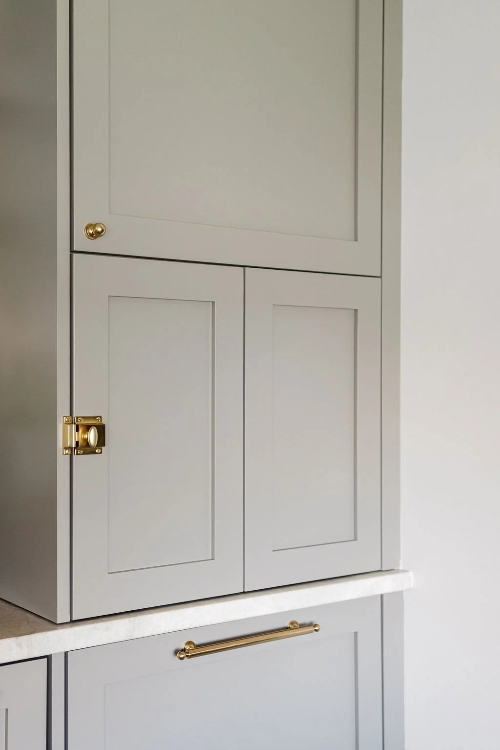 a close up of a frameless kitchen cabinet by Sean's Cabinetry