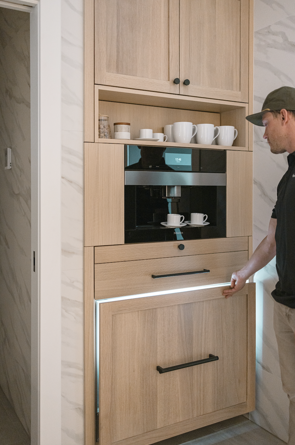 Built-in wood cabinets with coffee station and pull-out drawer