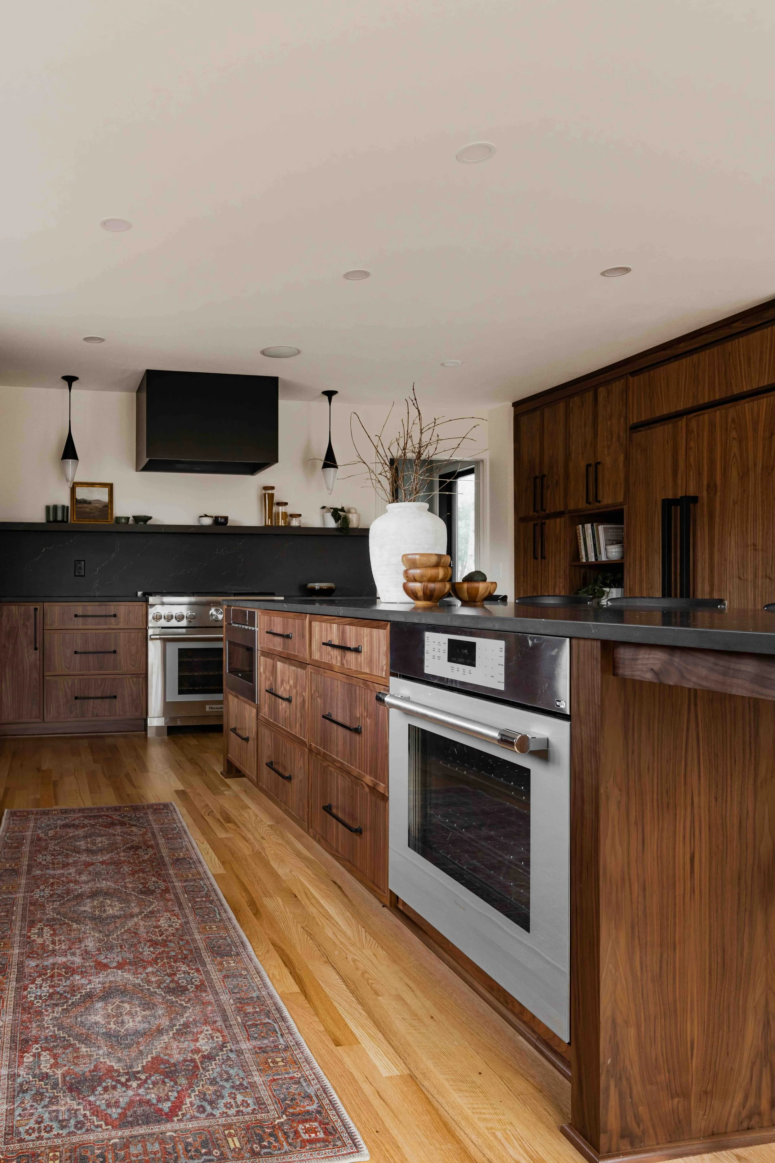 Moody Kitchen Island Design in Natural Walnut in a custom kitchen