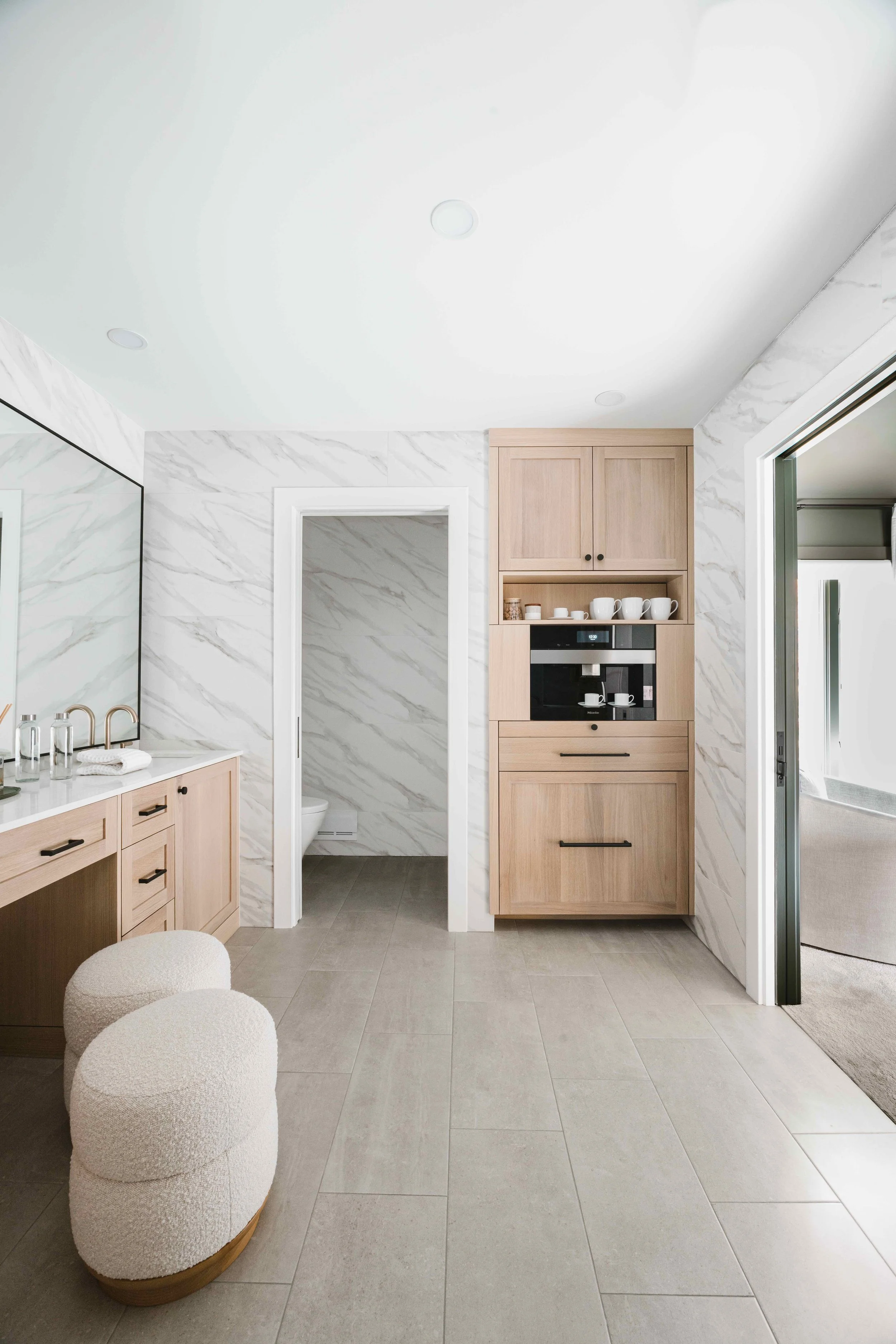 Built In Coffee Station Cabinet in rift sawn white oaks in a primary bathroom suite