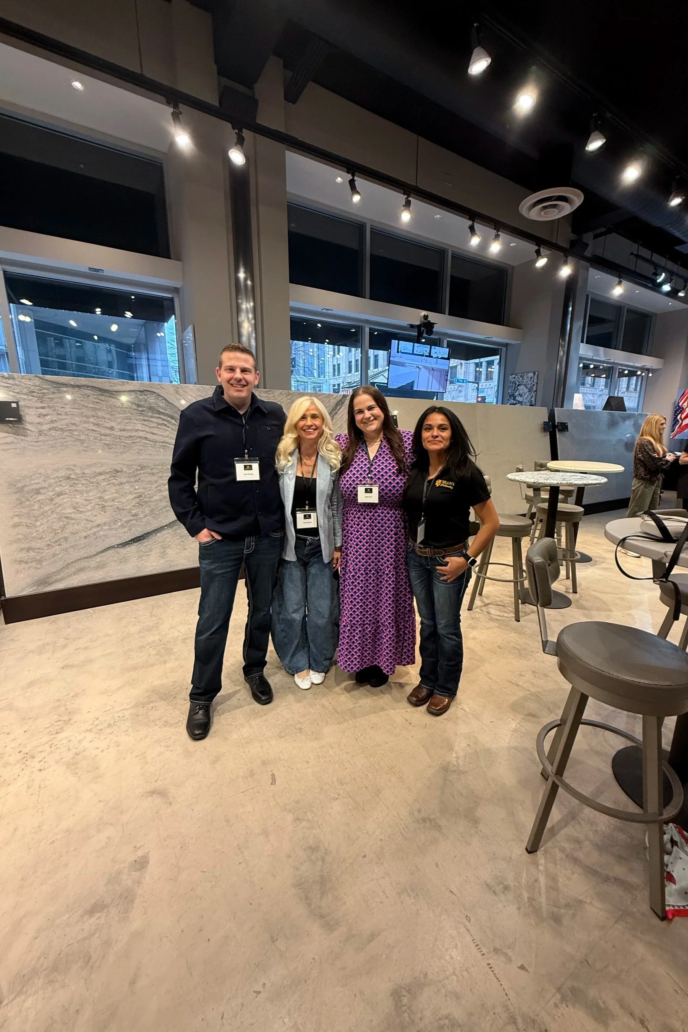 Sean Glessing of Sean's Cabinetry, Anya Bergland of Neon Lion Media, Kayla Schultz of construction2style and Nora Stanley of Sean's Cabinetry attending Cambria design event and learning about quality custom cabinetry