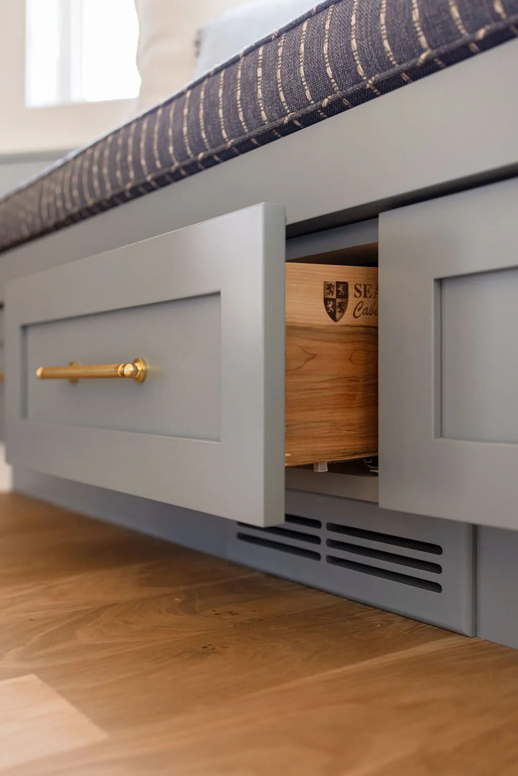half-open custom drawer in the Bay Window Bench with Storage | Sean's Cabinetry