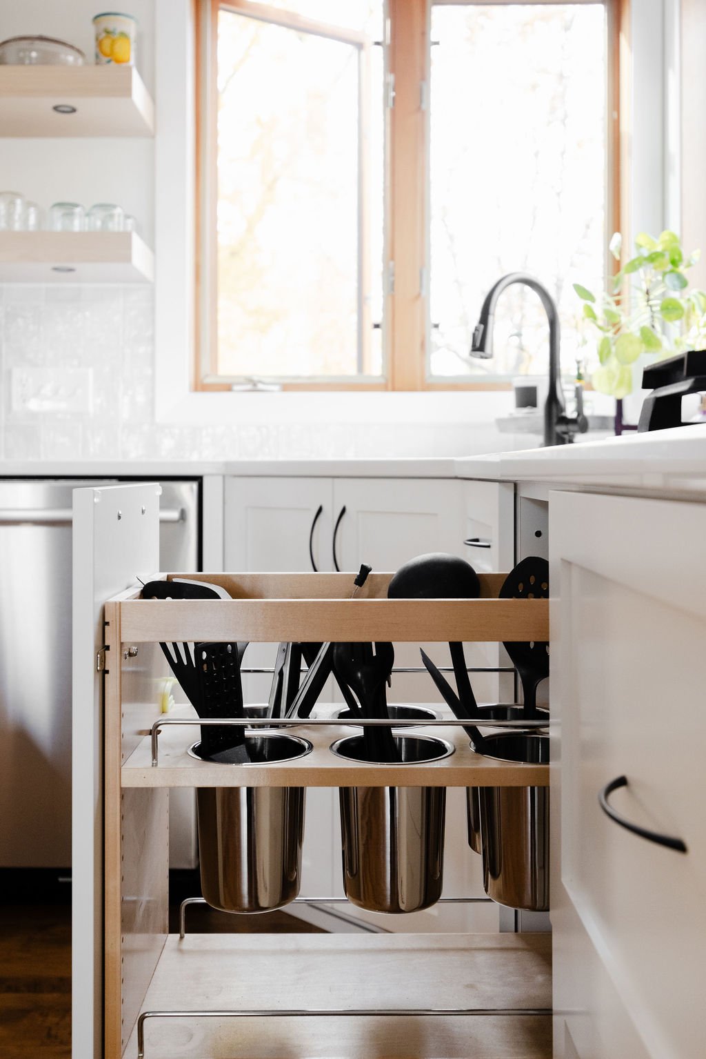 close-up photo of a Pull-Out Cabinet Utensil Organizer by Sean's cabinetry