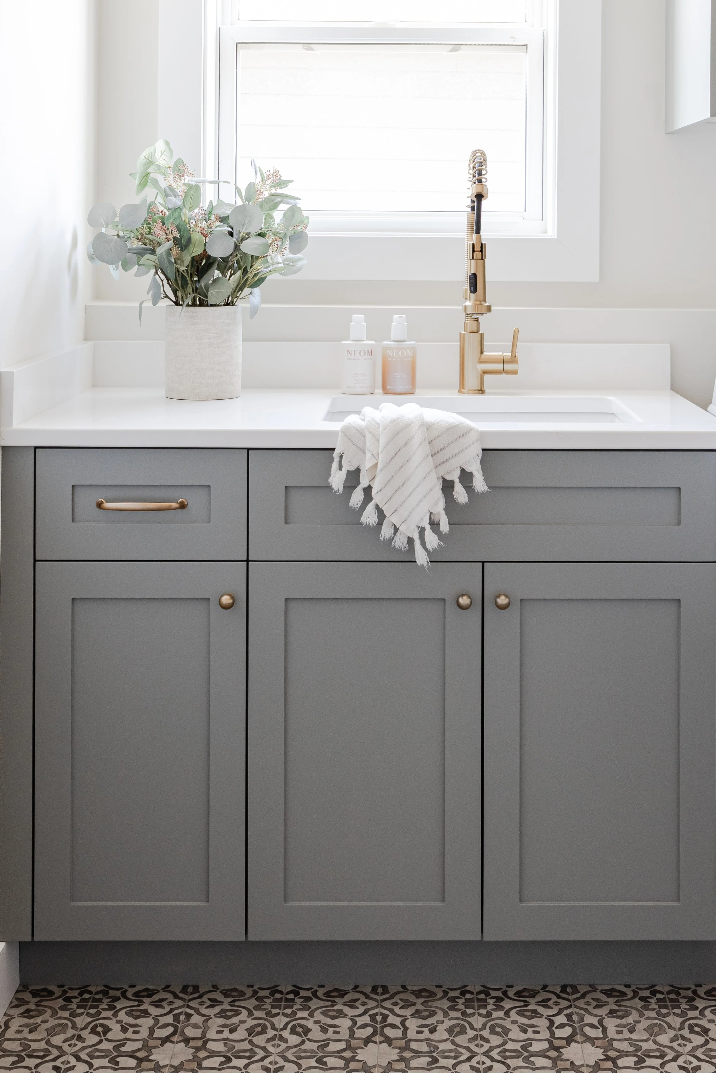 a photo of frameless, full-access laundry room cabinetry in a custom home in Minneapolis
