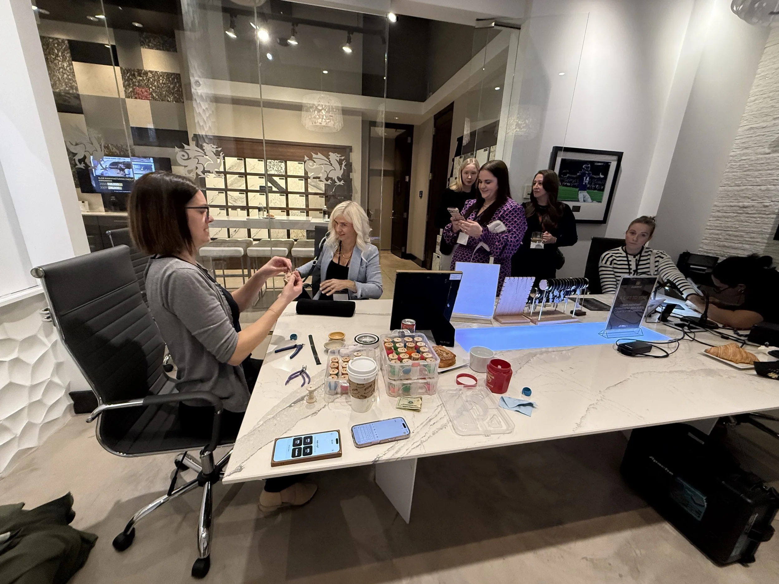 locket sisters are serving clients at Cambria design events and fitting their permanent jewelry for women