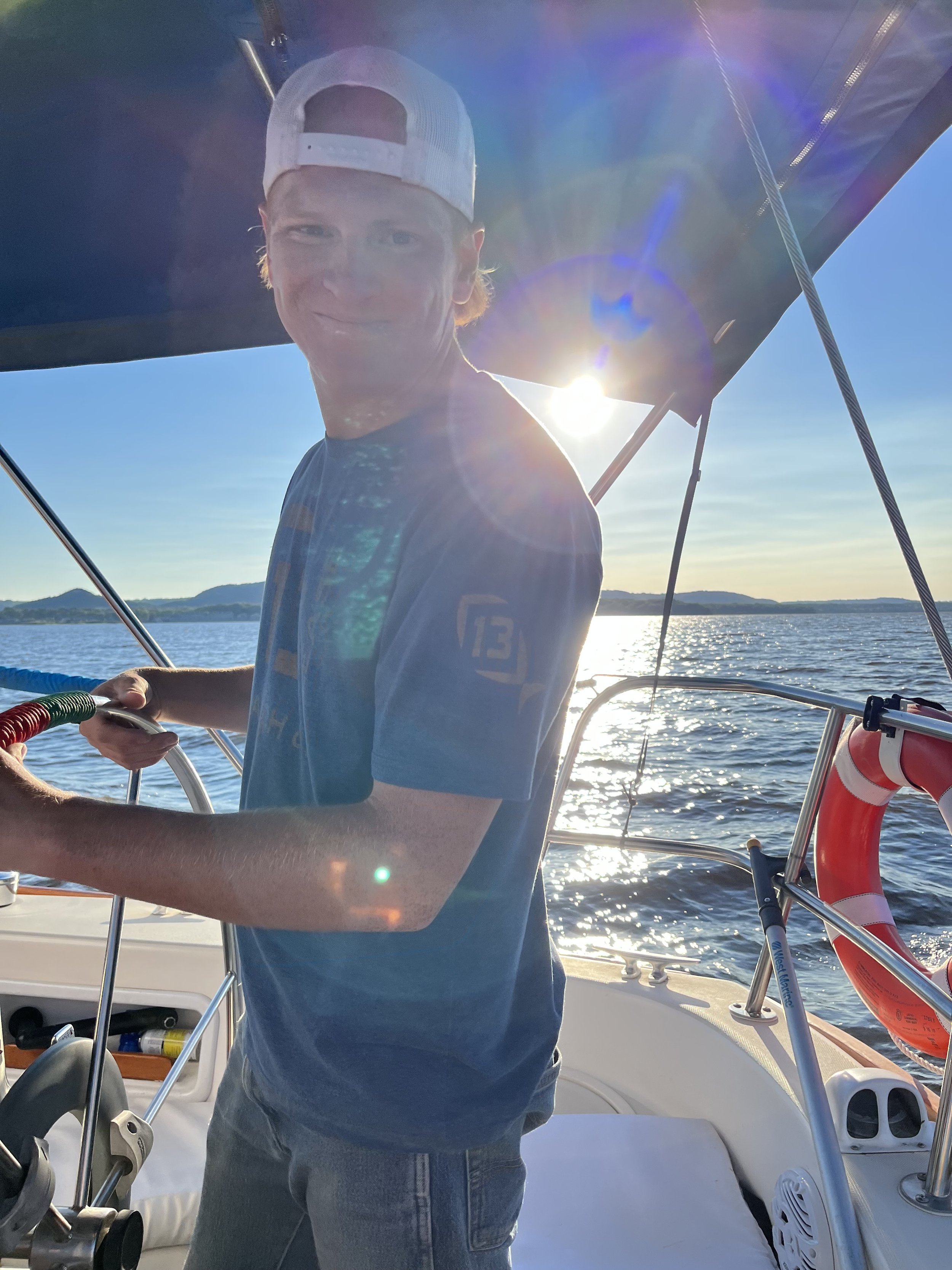 a photo of Sam Miller, our expert in sales process at Sean's cabinetry standing on the boat