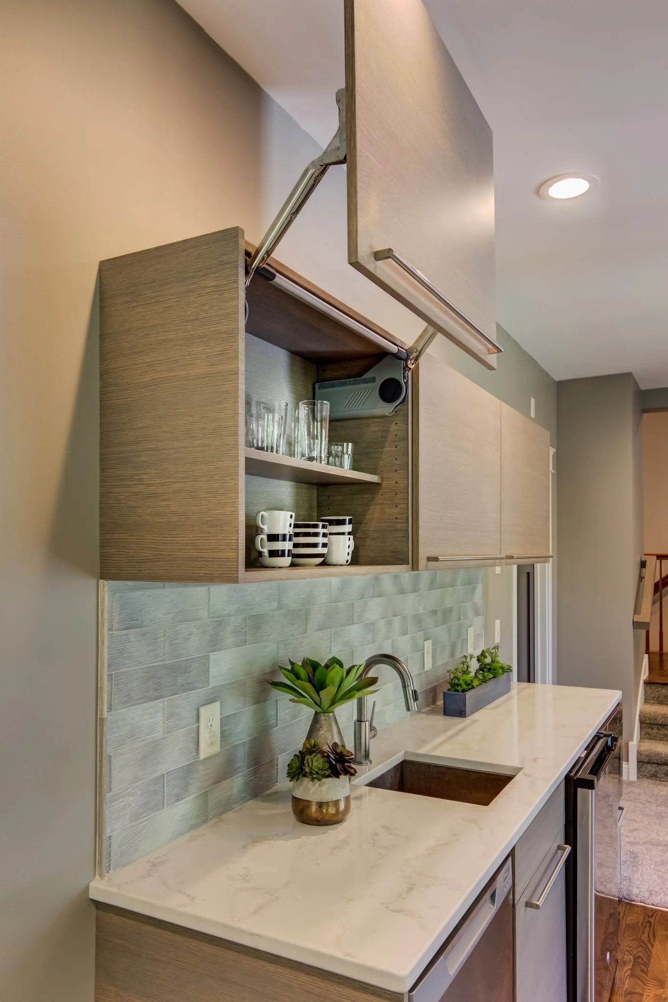a close-up photo of a Vertical Lift Up Cabinet Door on a living room wet bar | Sean's Cabinetry
