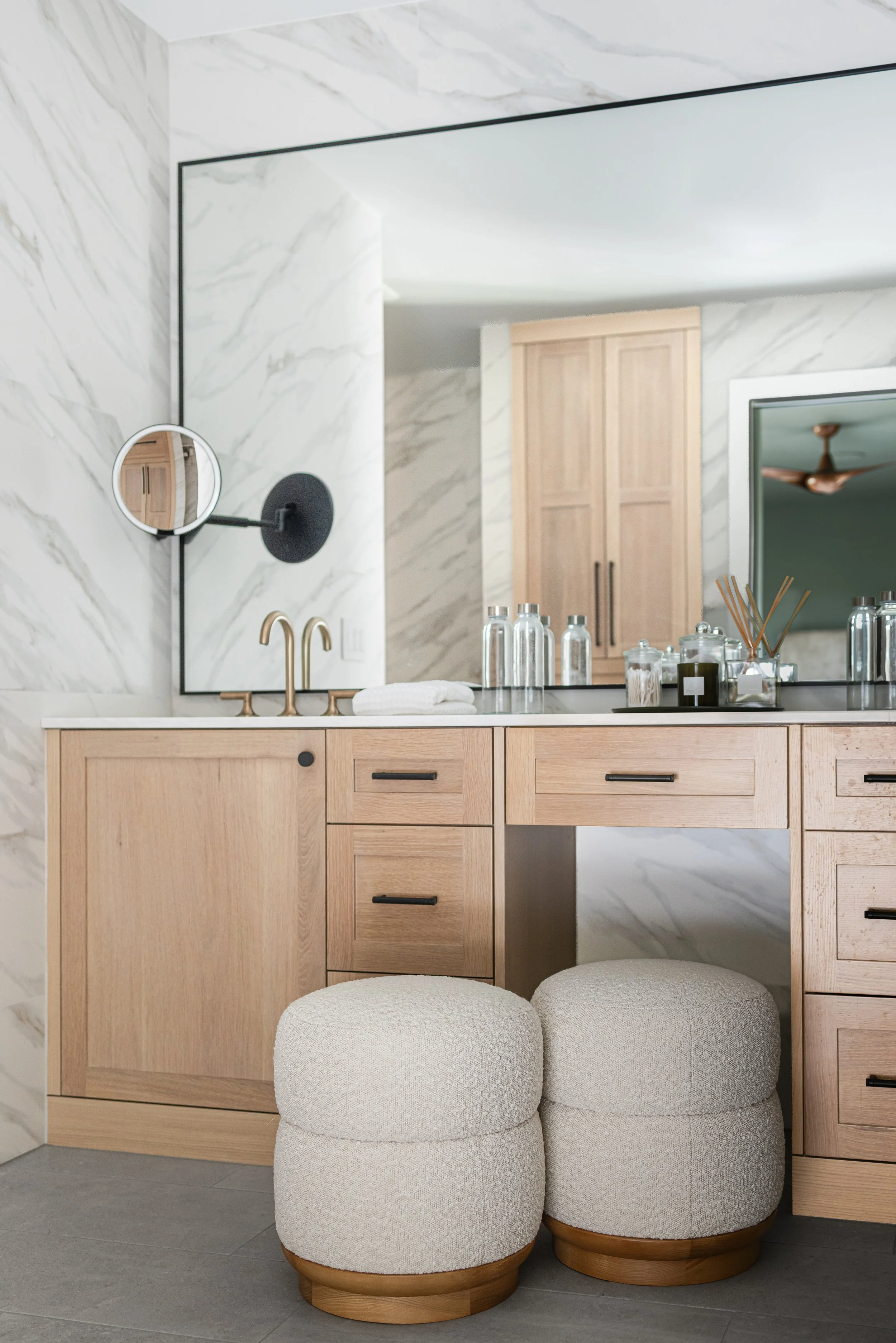 a close-up photo of a double bathroom vanity and a reflection of a linen closet in rift sawn white oak