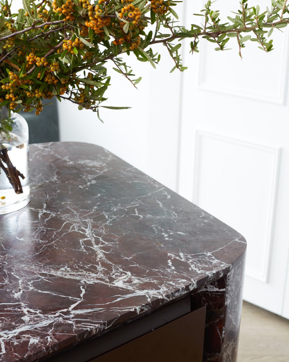 Cambridge Terrace | Kitchen Details

The rich red tones of Rosso Lepanto natural stone take centre stage in the heart of our Cambridge project, forming a bold contrast against the crisp white-panelled cabinetry. Timeless brass detailing adds warmth a