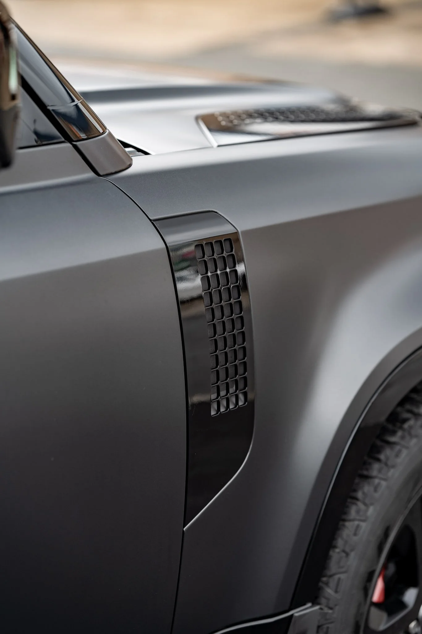 Close-up of Defender side vent detailing. Even complex trims and textured areas are carefully worked around during Paint Protection Film installation for a clean, refined finish.