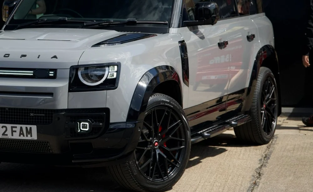 Defender with the Utopia Kit fitted, gloss black arches, canards and side steps