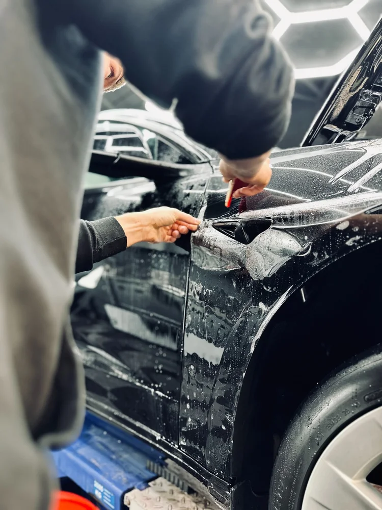 Paint protection film detail on a car at Utopia